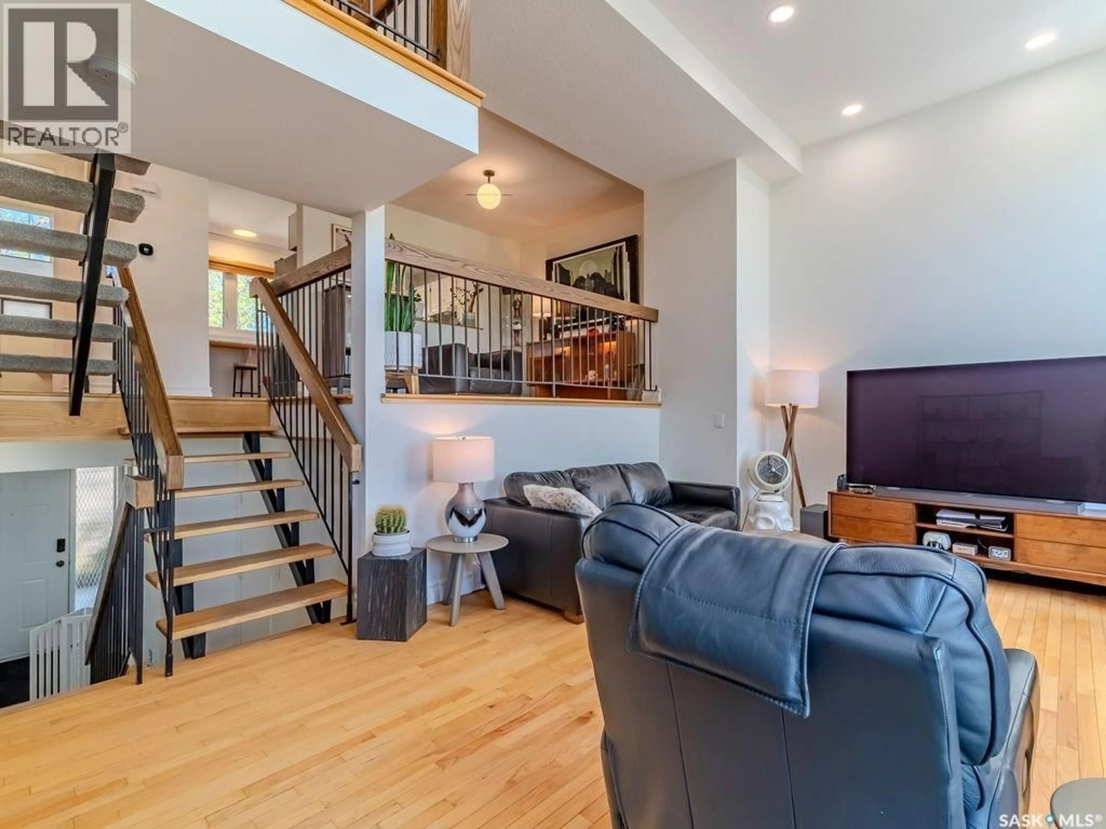 Living room with furniture, wood/laminate floor for 13 455 PINEHOUSE DRIVE, Saskatoon Saskatchewan S7K5X1