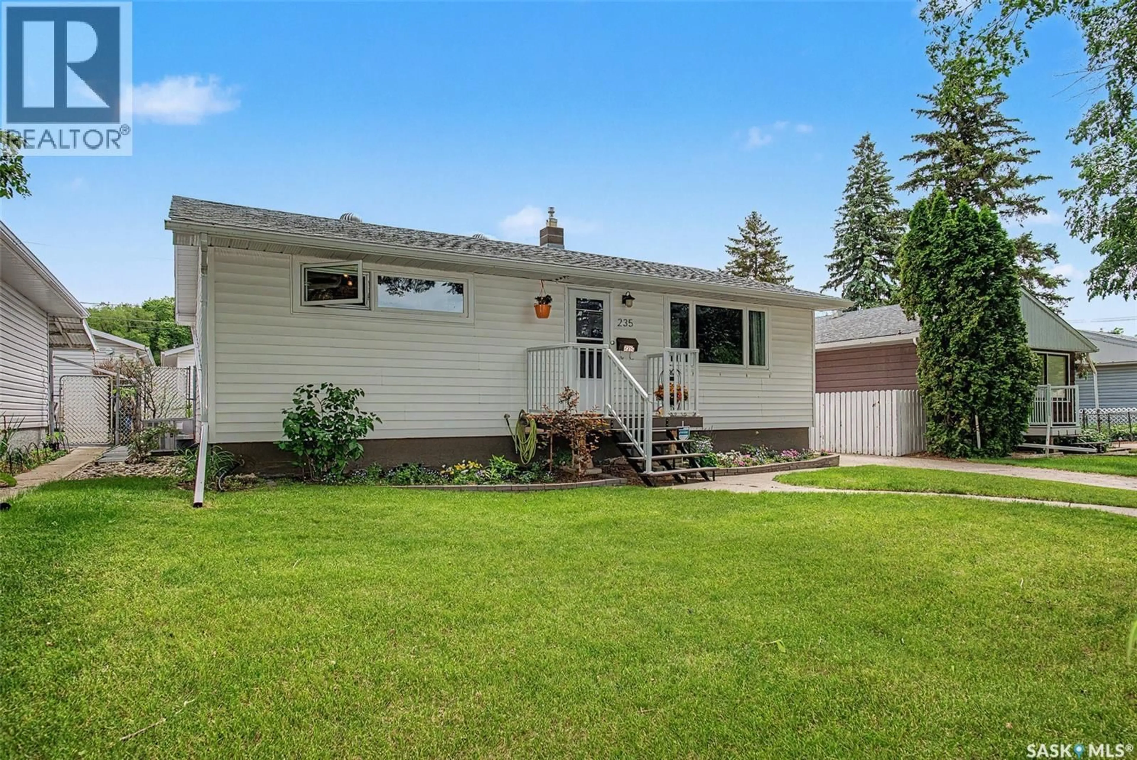 Home with vinyl exterior material, street for 235 TORONTO STREET, Regina Saskatchewan S4R0M3