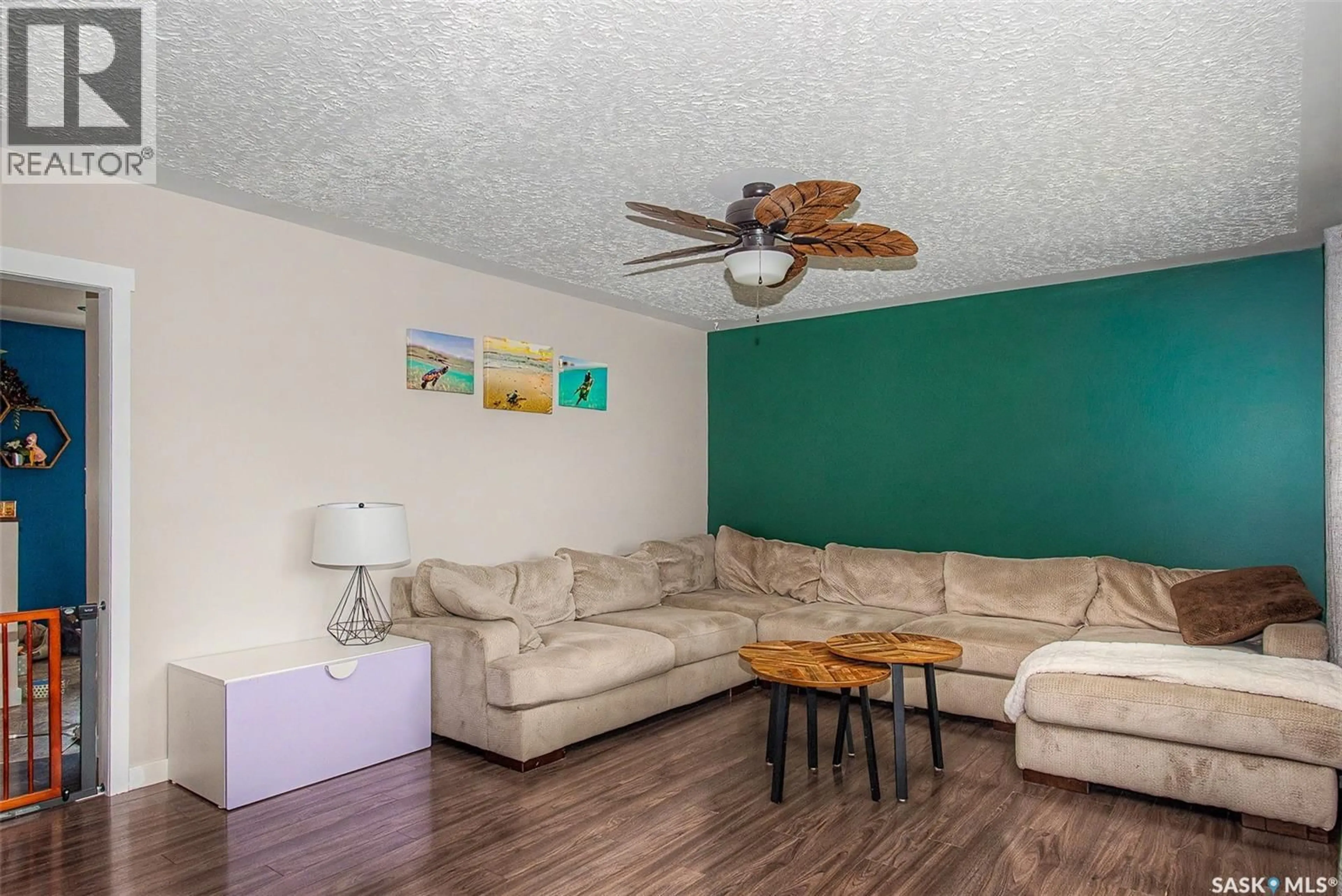 Living room with furniture, wood/laminate floor for 235 TORONTO STREET, Regina Saskatchewan S4R0M3
