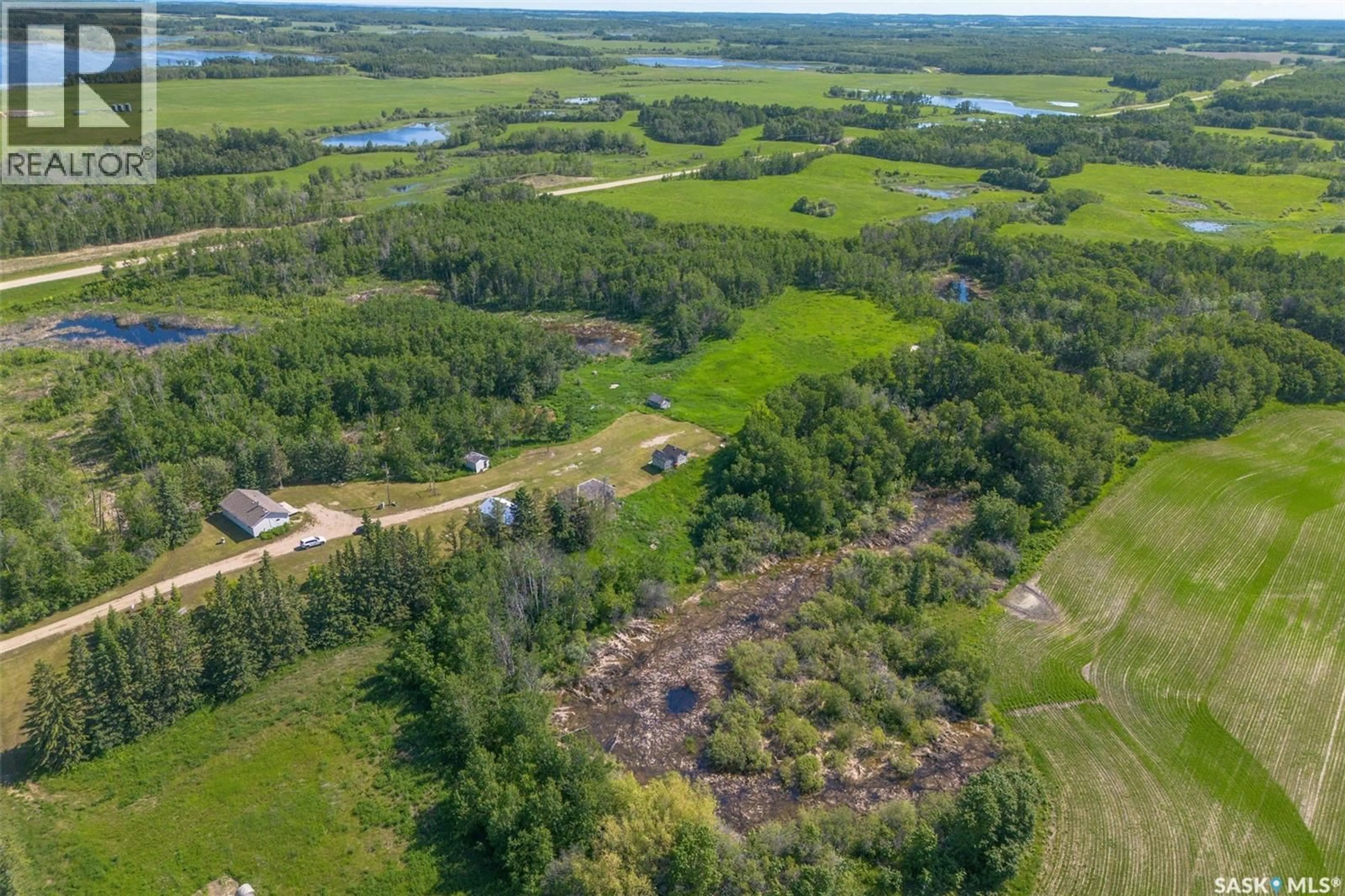 A pic from outside/outdoor area/front of a property/back of a property/a pic from drone, water/lake/river/ocean view for CHABOT ACREAGE, Three Lakes Rm No. 400 Saskatchewan S0K3V0