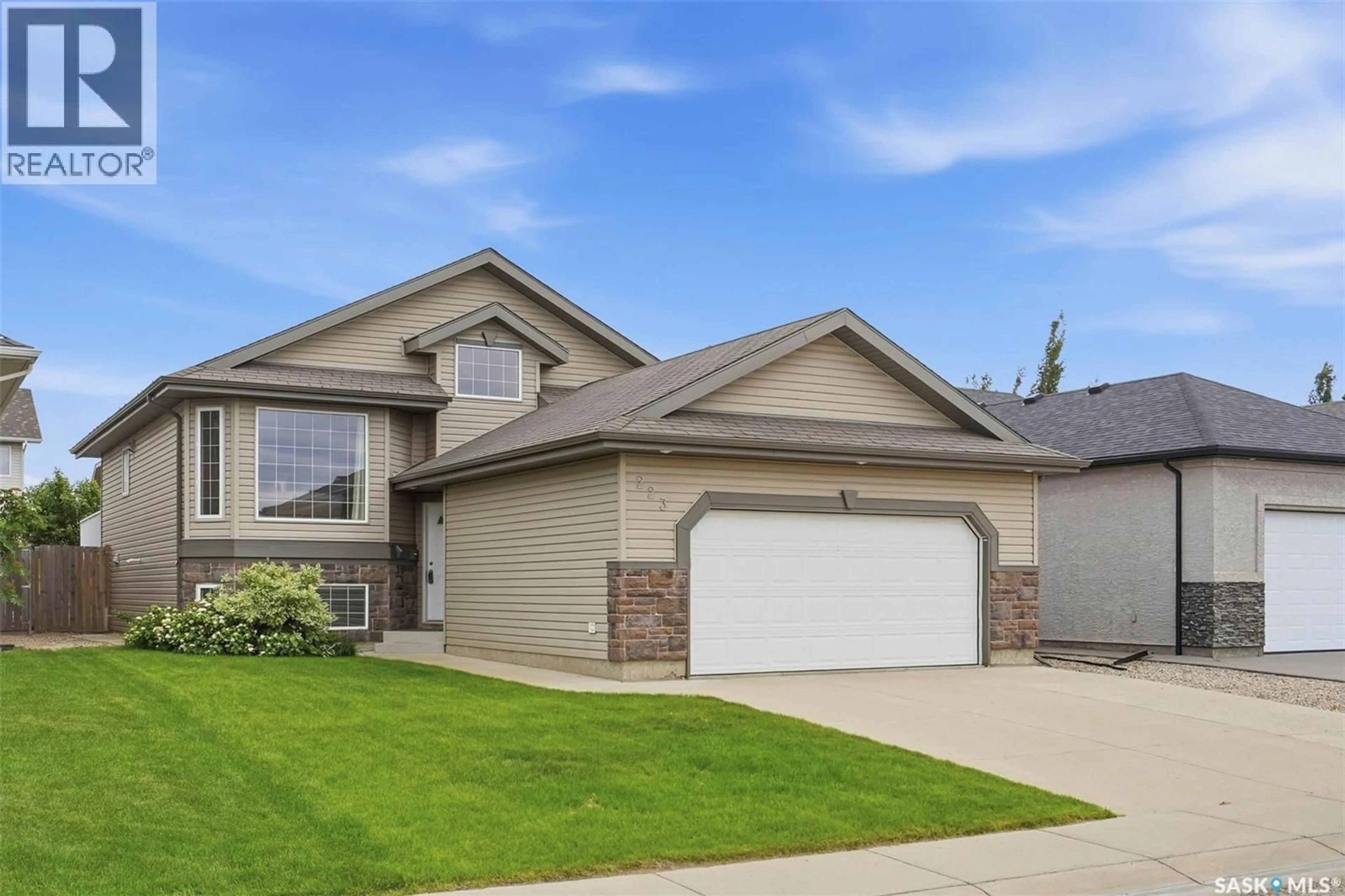 Home with vinyl exterior material, street for 223 TRIMBLE LANE, Saskatoon Saskatchewan S7W0C9