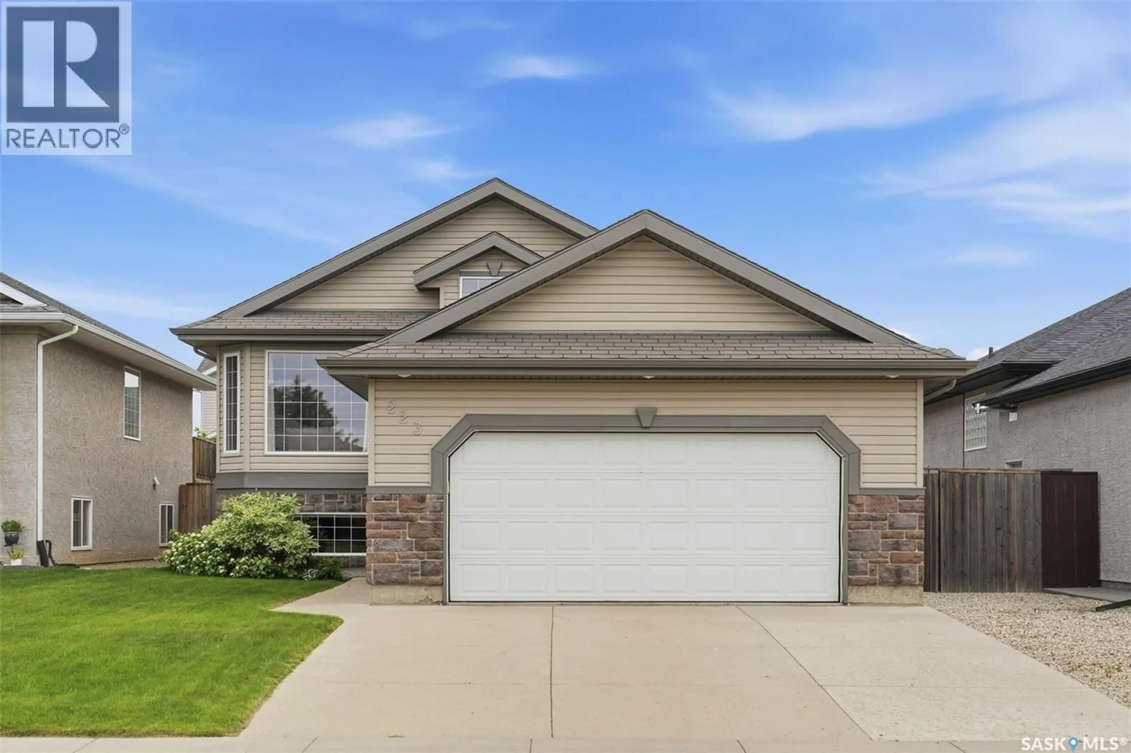 Home with vinyl exterior material, street for 223 TRIMBLE LANE, Saskatoon Saskatchewan S7W0C9
