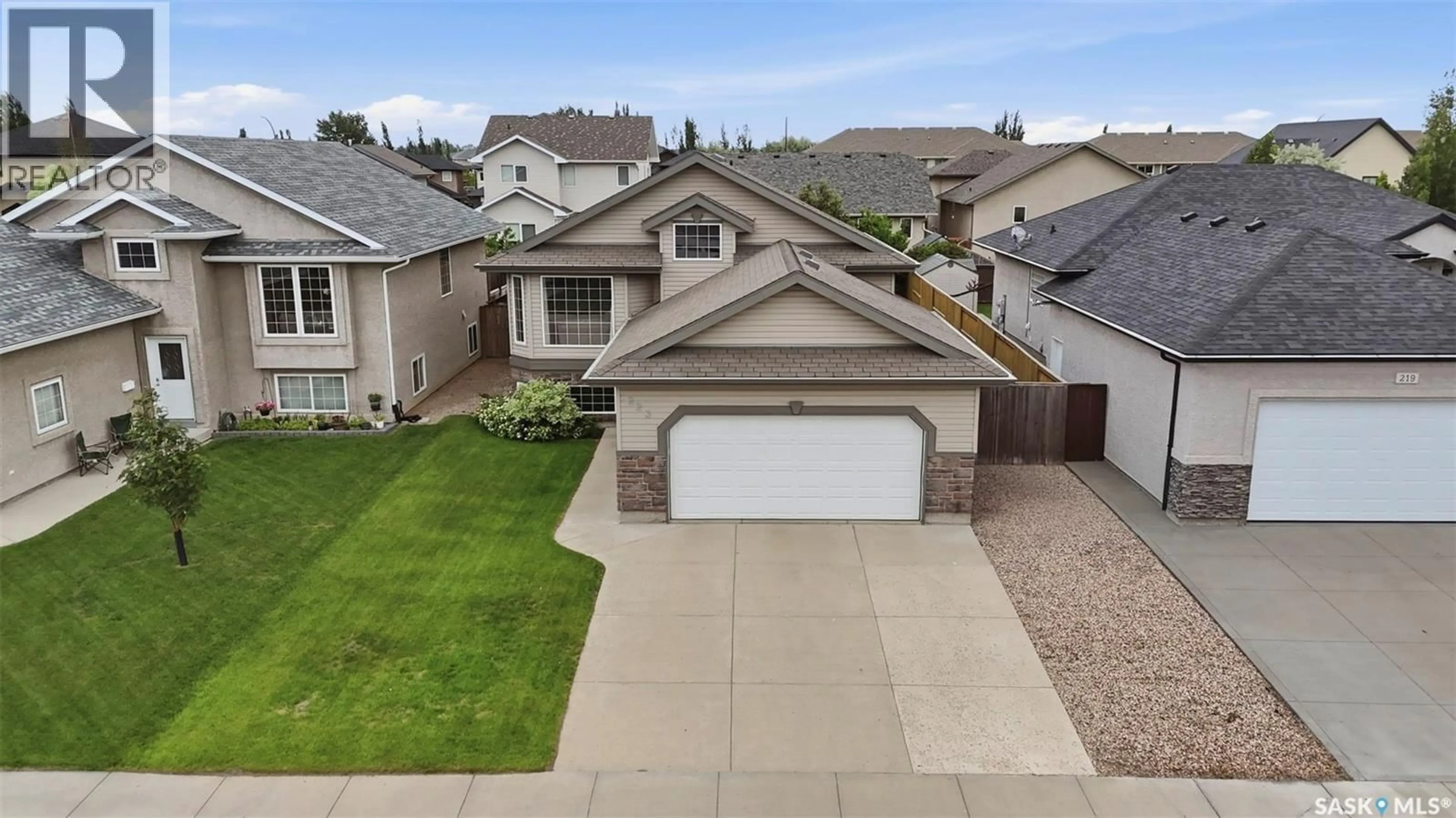 A pic from outside/outdoor area/front of a property/back of a property/a pic from drone, street for 223 TRIMBLE LANE, Saskatoon Saskatchewan S7W0C9