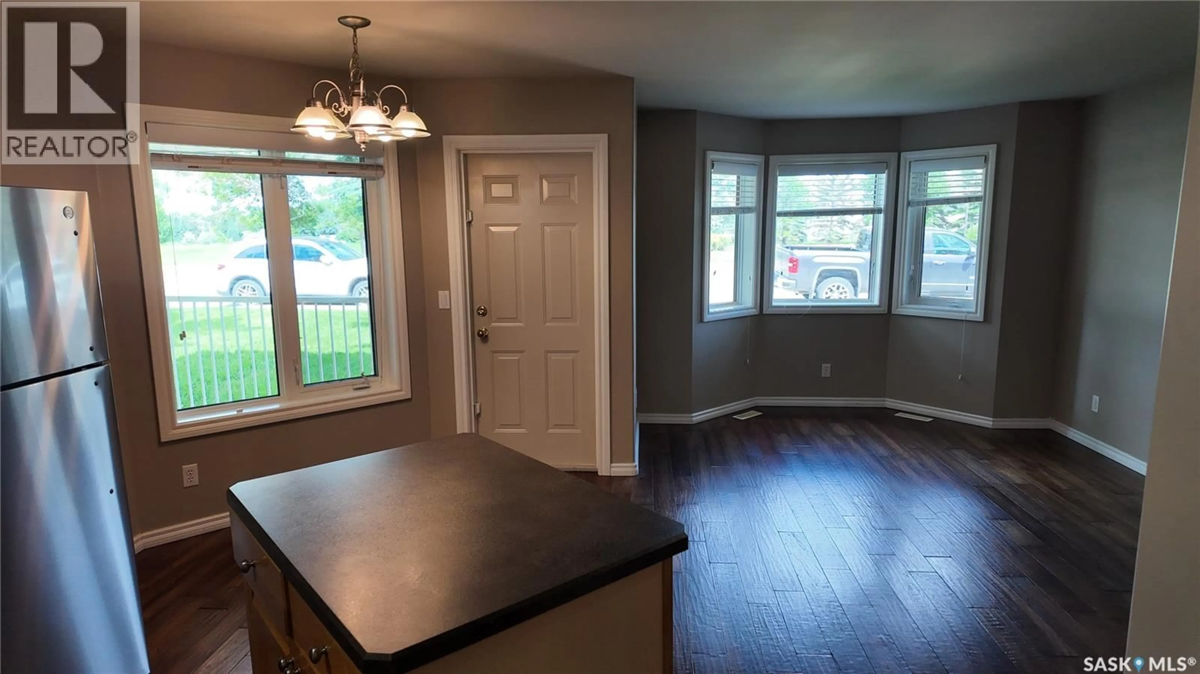 Open concept kitchen, wood/laminate floor for 3241 WOODHAMS DRIVE, Regina Saskatchewan S4V3A2