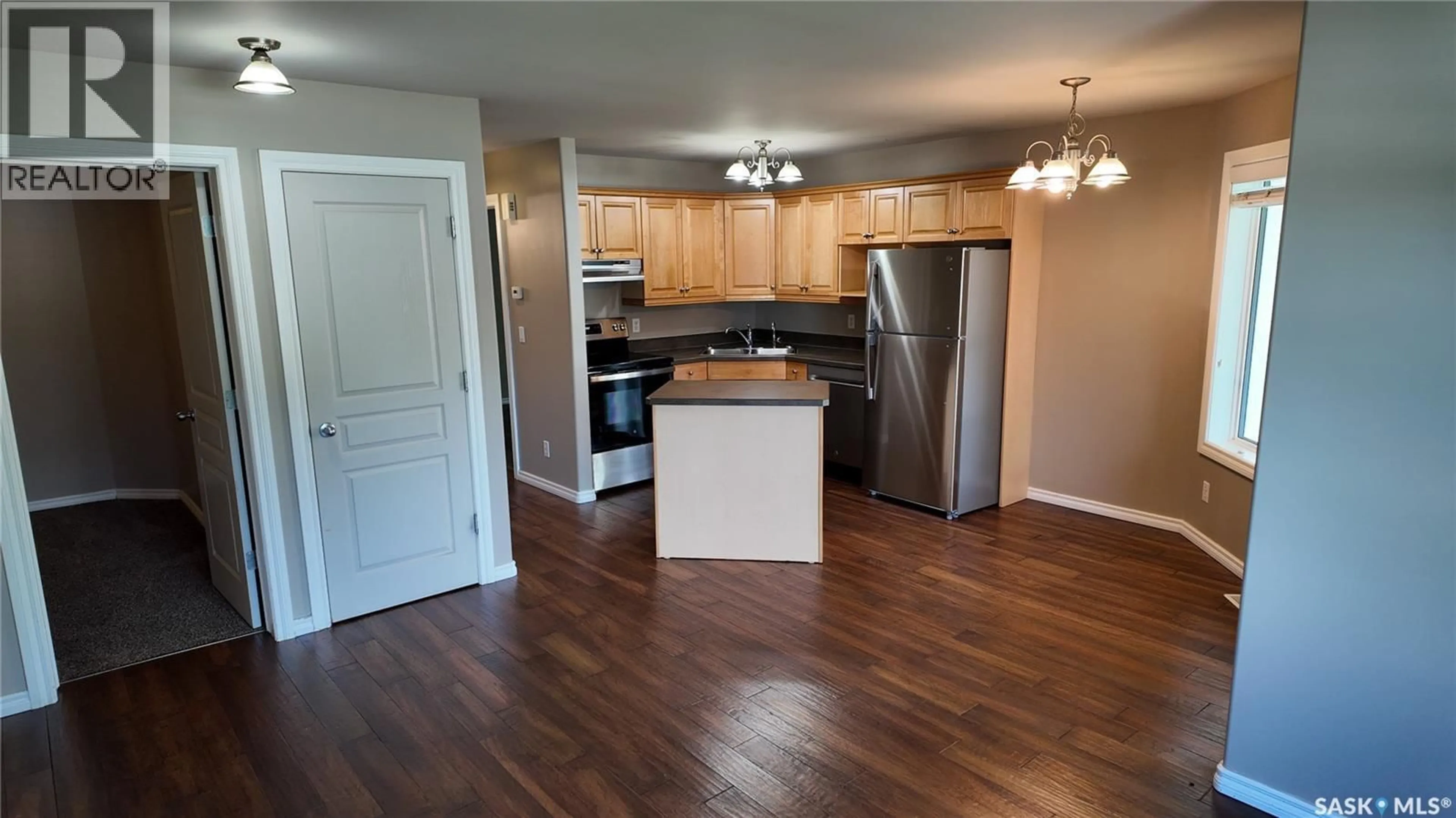 Open concept kitchen, wood/laminate floor for 3241 WOODHAMS DRIVE, Regina Saskatchewan S4V3A2