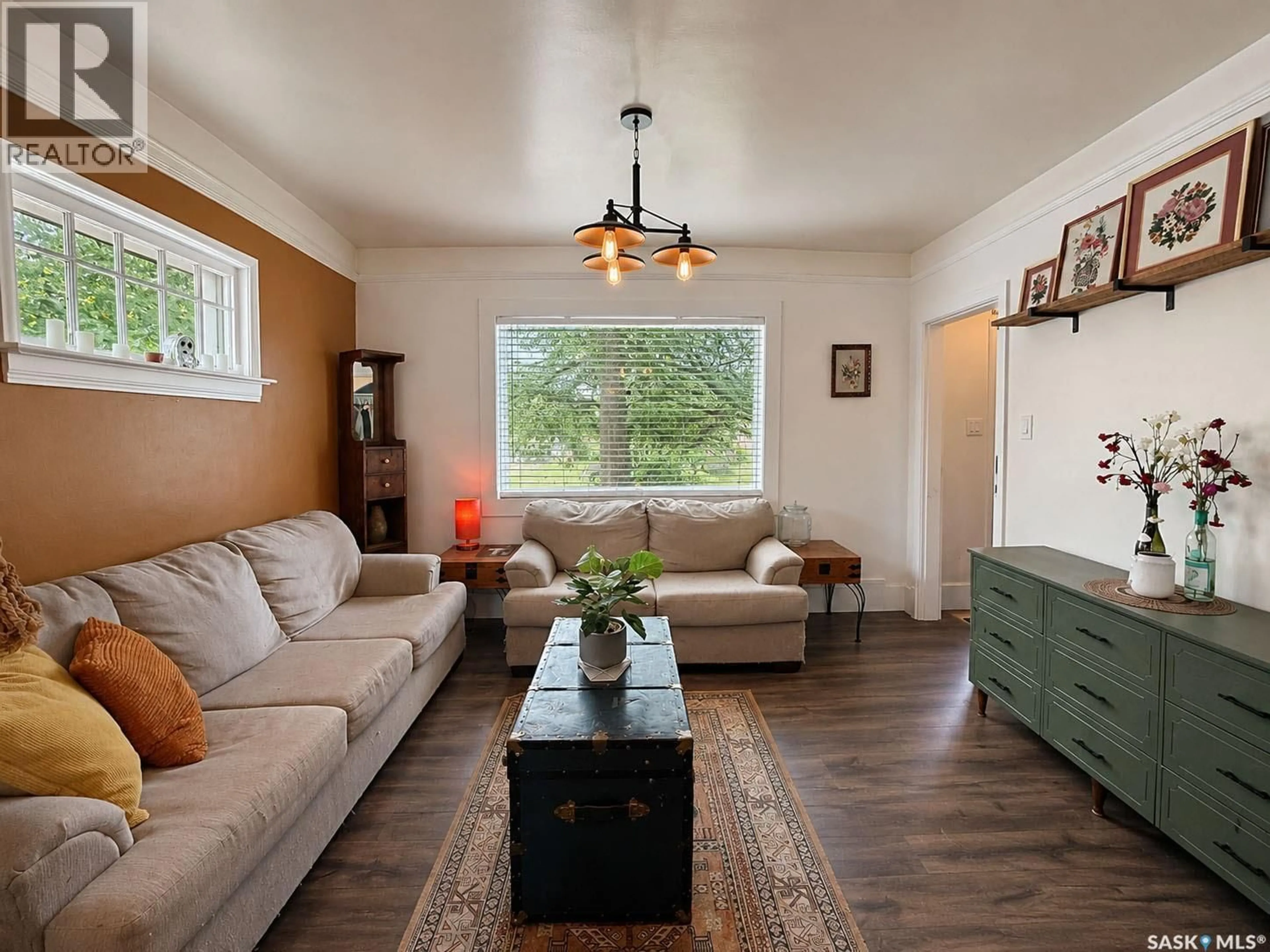 Living room with furniture, wood/laminate floor for 684 8TH STREET, Prince Albert Saskatchewan S6V0W7