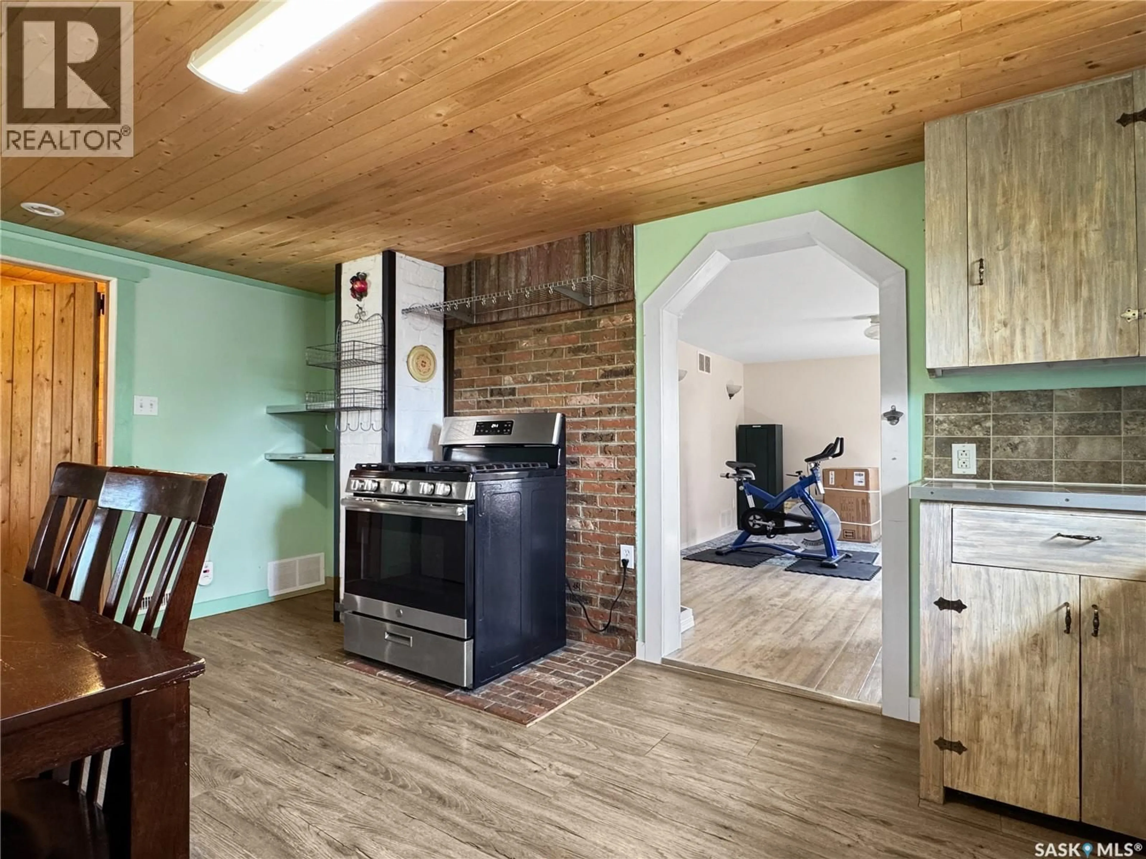 Open concept kitchen, wood/laminate floor for E - 205 4TH STREET, Wilkie Saskatchewan S0K4W0