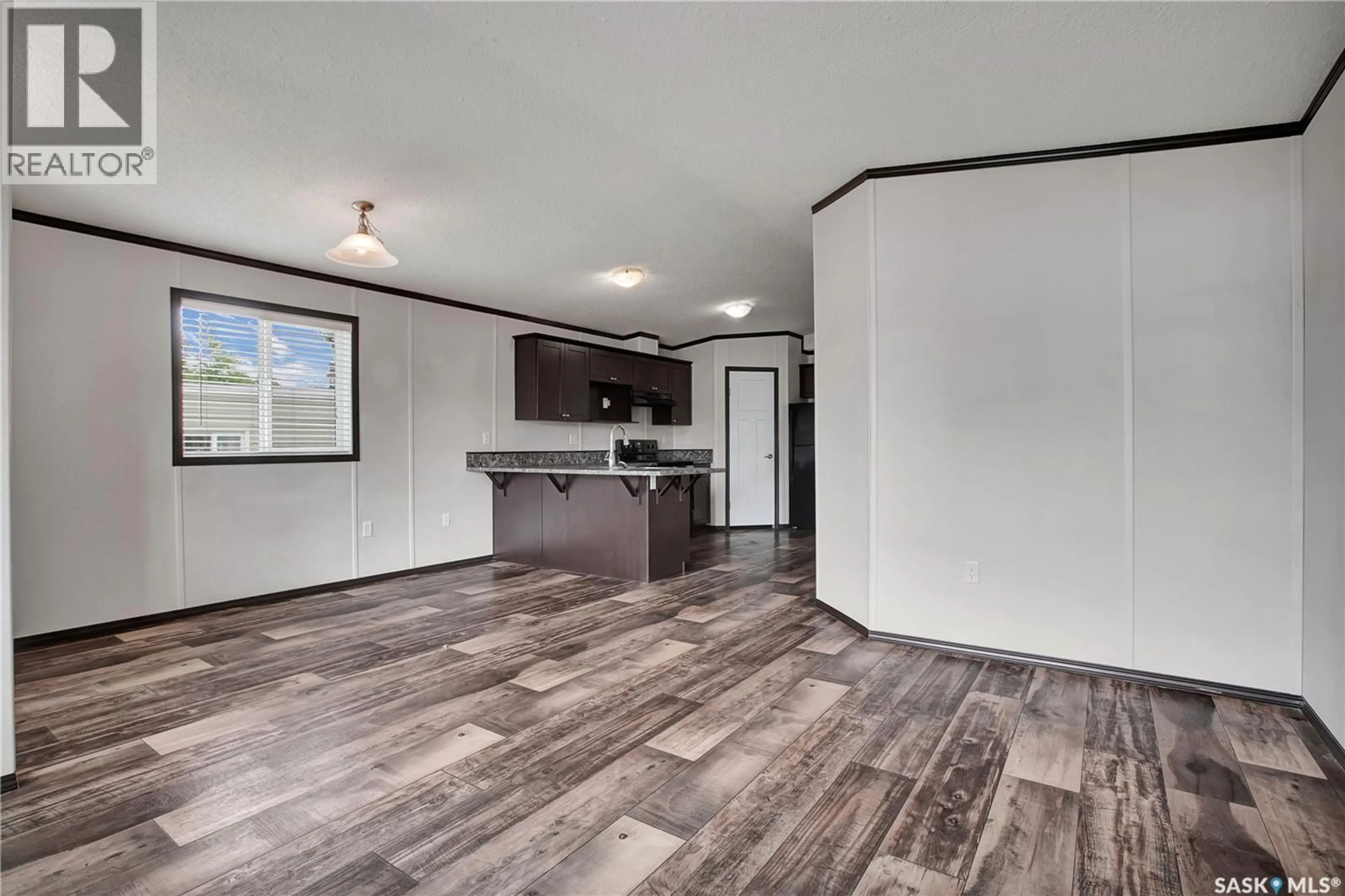 Open concept kitchen, wood/laminate floor for 219 - 125 GRANT STREET, Saskatoon Saskatchewan S7N2A5