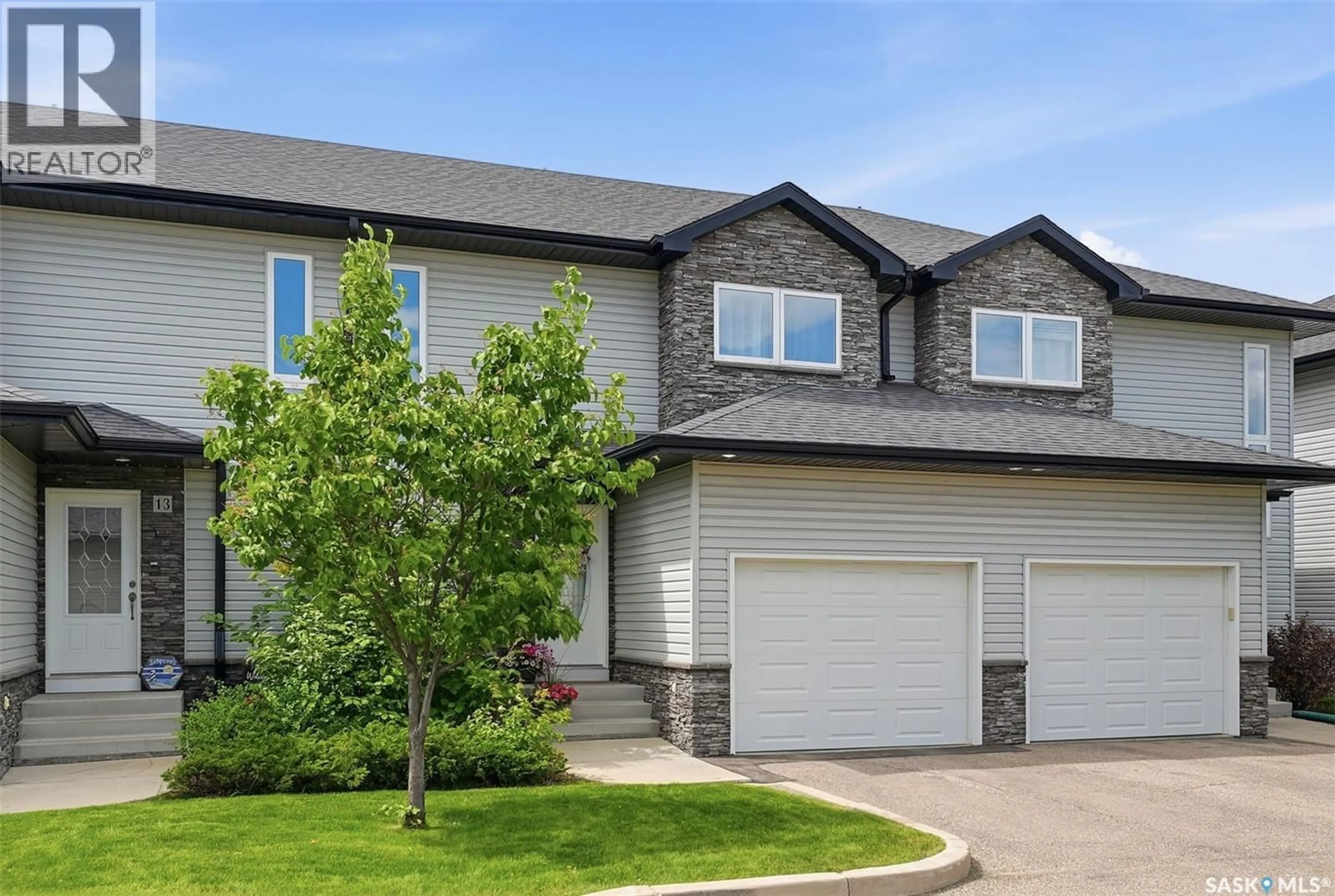 Home with vinyl exterior material, street for 12 547 EAST HAMPTON BOULEVARD, Saskatoon Saskatchewan S7R0H8
