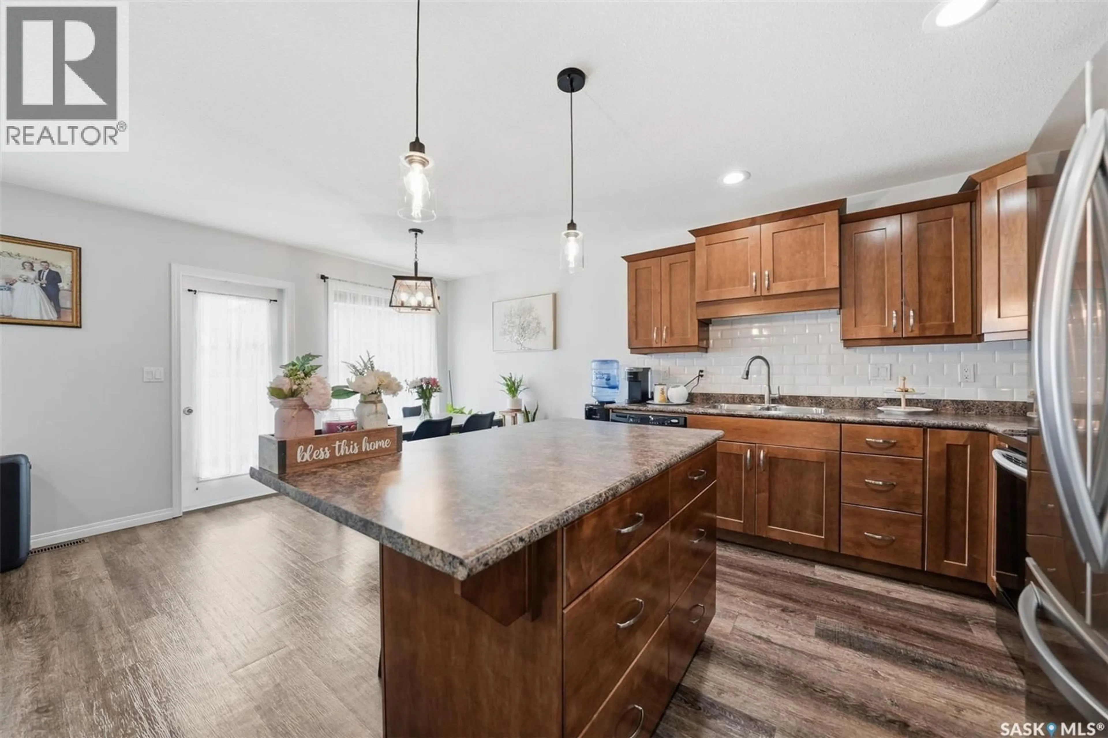 Open concept kitchen, ceramic/tile floor for 12 547 EAST HAMPTON BOULEVARD, Saskatoon Saskatchewan S7R0H8