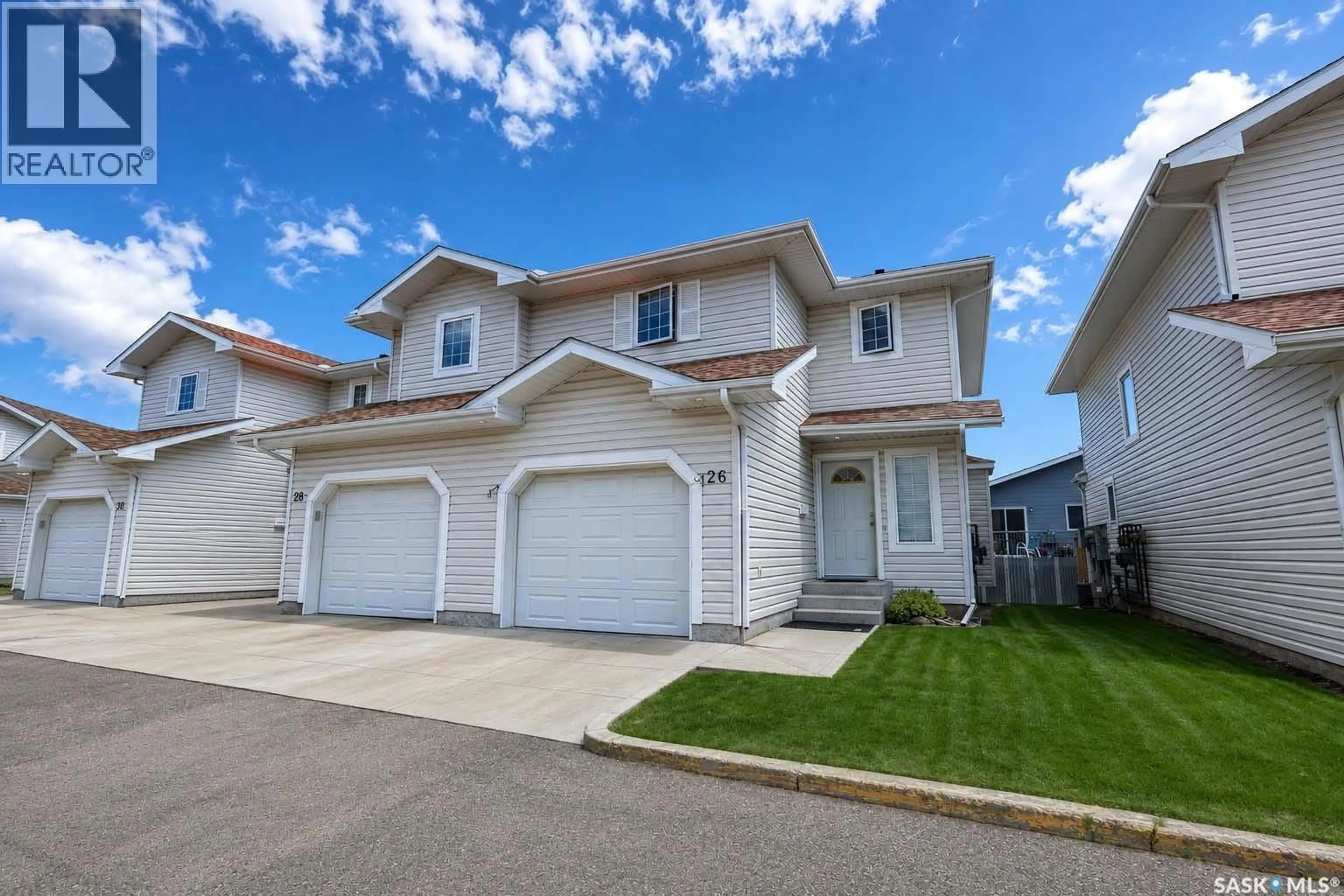 Home with vinyl exterior material, street for 1620 - 26 OLIVE DIEFENBAKER DRIVE, Prince Albert Saskatchewan S6X1C5