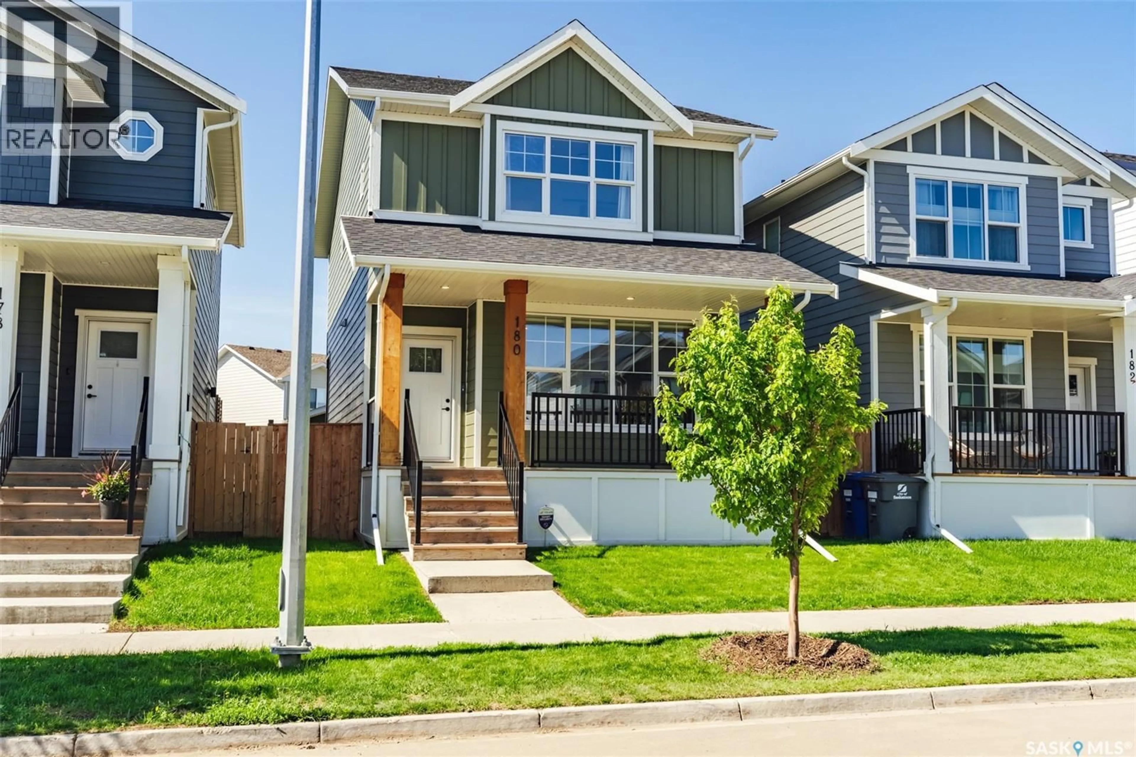 Home with vinyl exterior material, street for 180 ROSEWOOD BOULEVARD, Saskatoon Saskatchewan S7V0Y9
