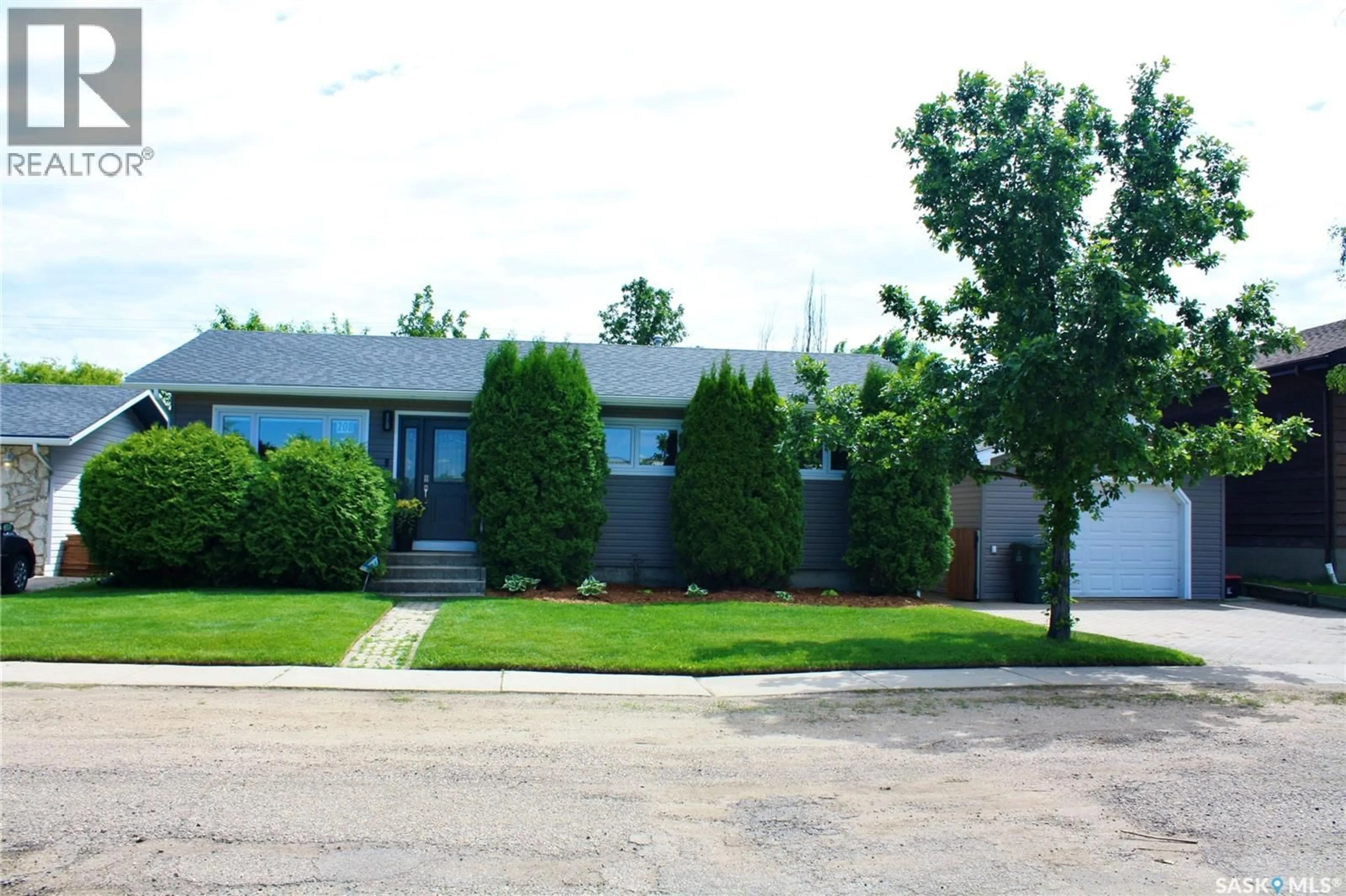 Home with vinyl exterior material, street for 208 JAMES STREET, Langham Saskatchewan S0K2L0