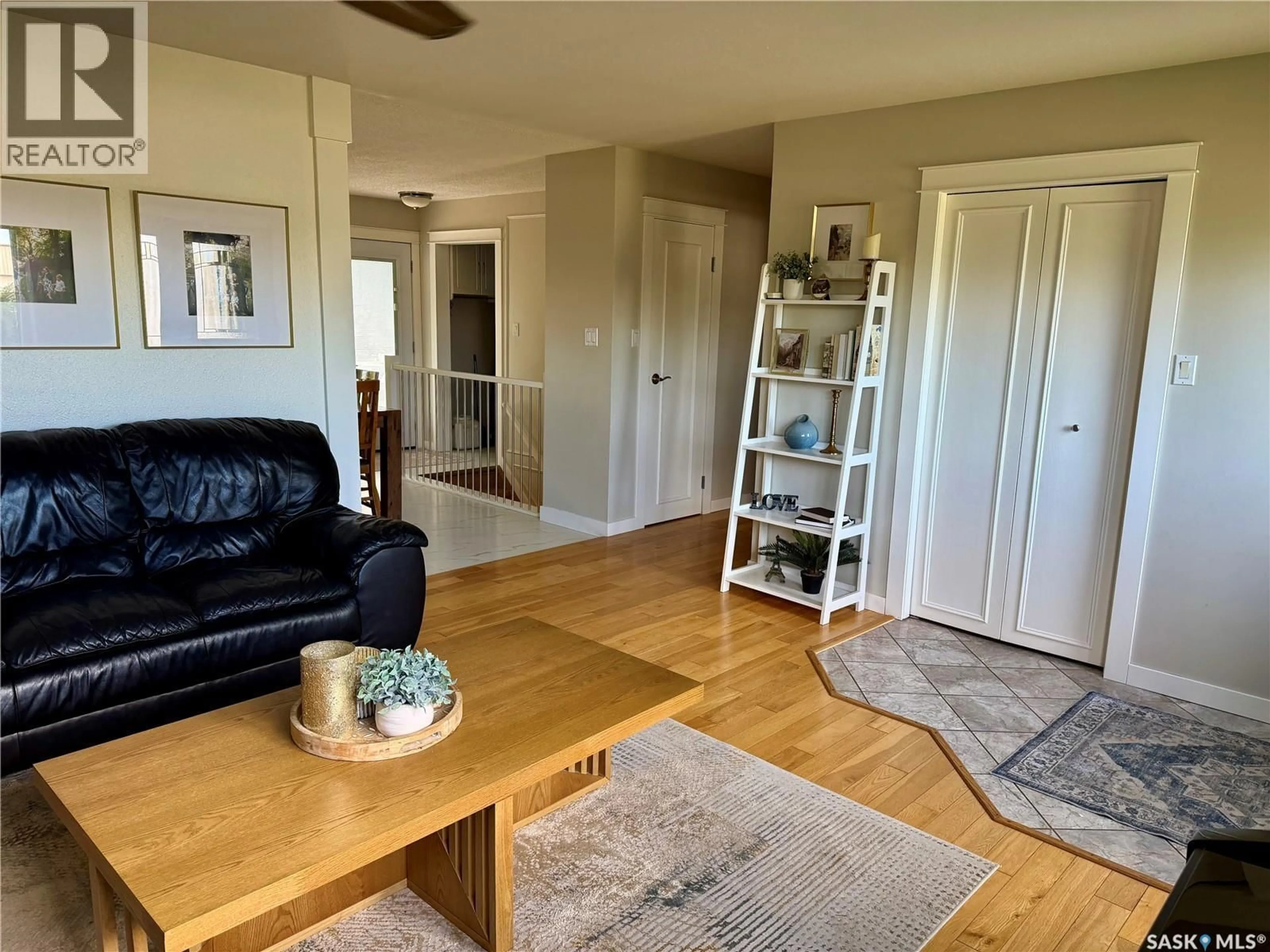Living room with furniture, wood/laminate floor for 208 JAMES STREET, Langham Saskatchewan S0K2L0