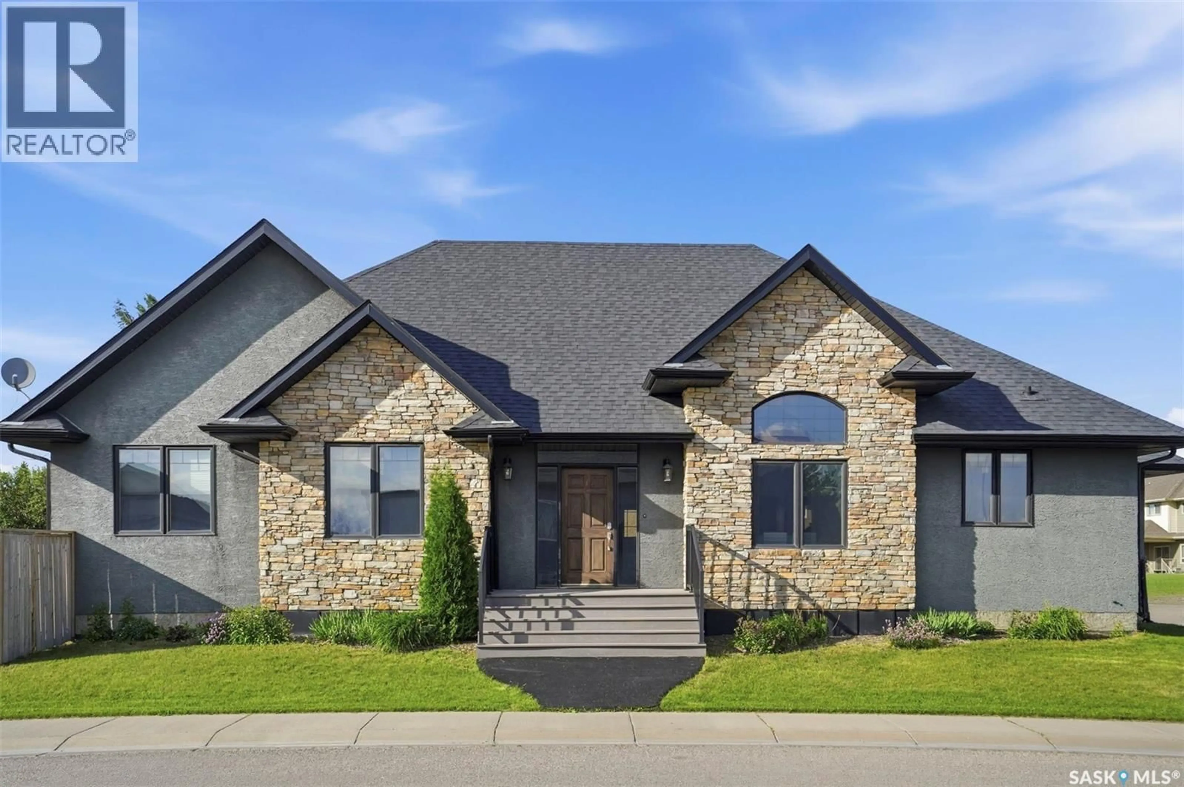 Home with brick exterior material, street for 1103 STENSRUD ROAD, Saskatoon Saskatchewan S7W0C9