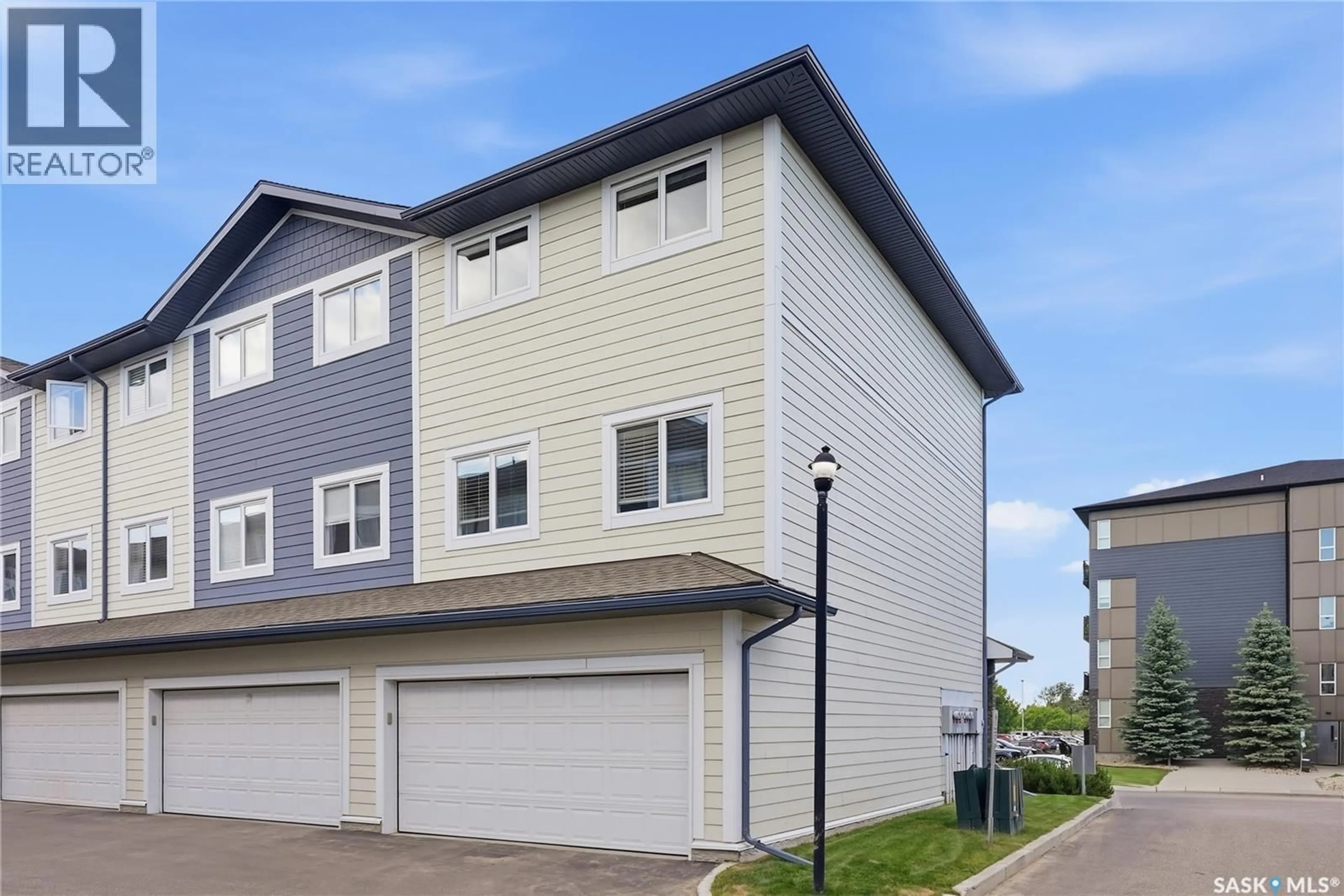 Home with vinyl exterior material, street for 212 - 220 WILLIS CRESCENT, Saskatoon Saskatchewan S7T0R6