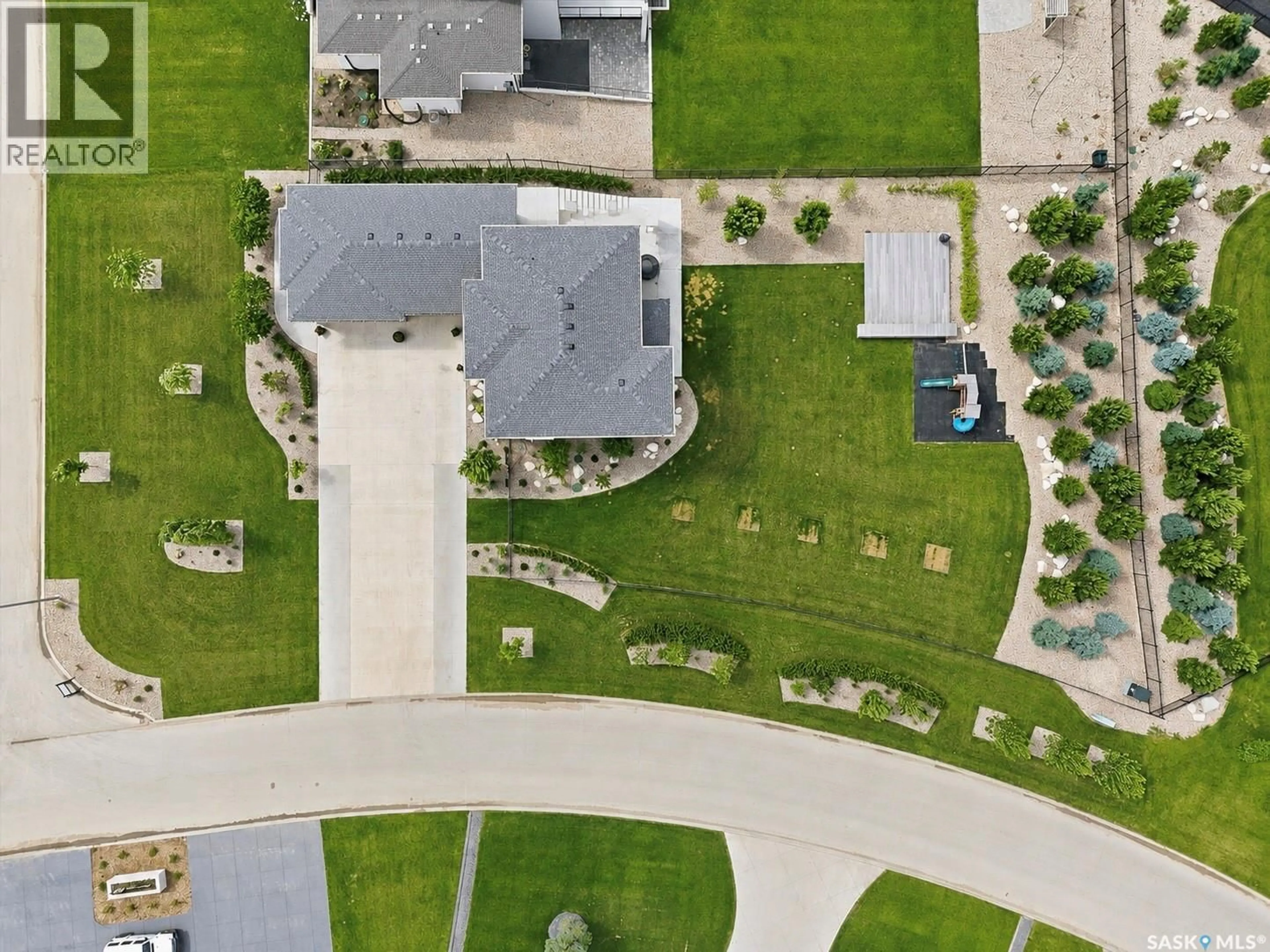 A pic from outside/outdoor area/front of a property/back of a property/a pic from drone, street for 102 GREENBRYRE AVENUE, Corman Park Rm No. 344 Saskatchewan S7V0J4