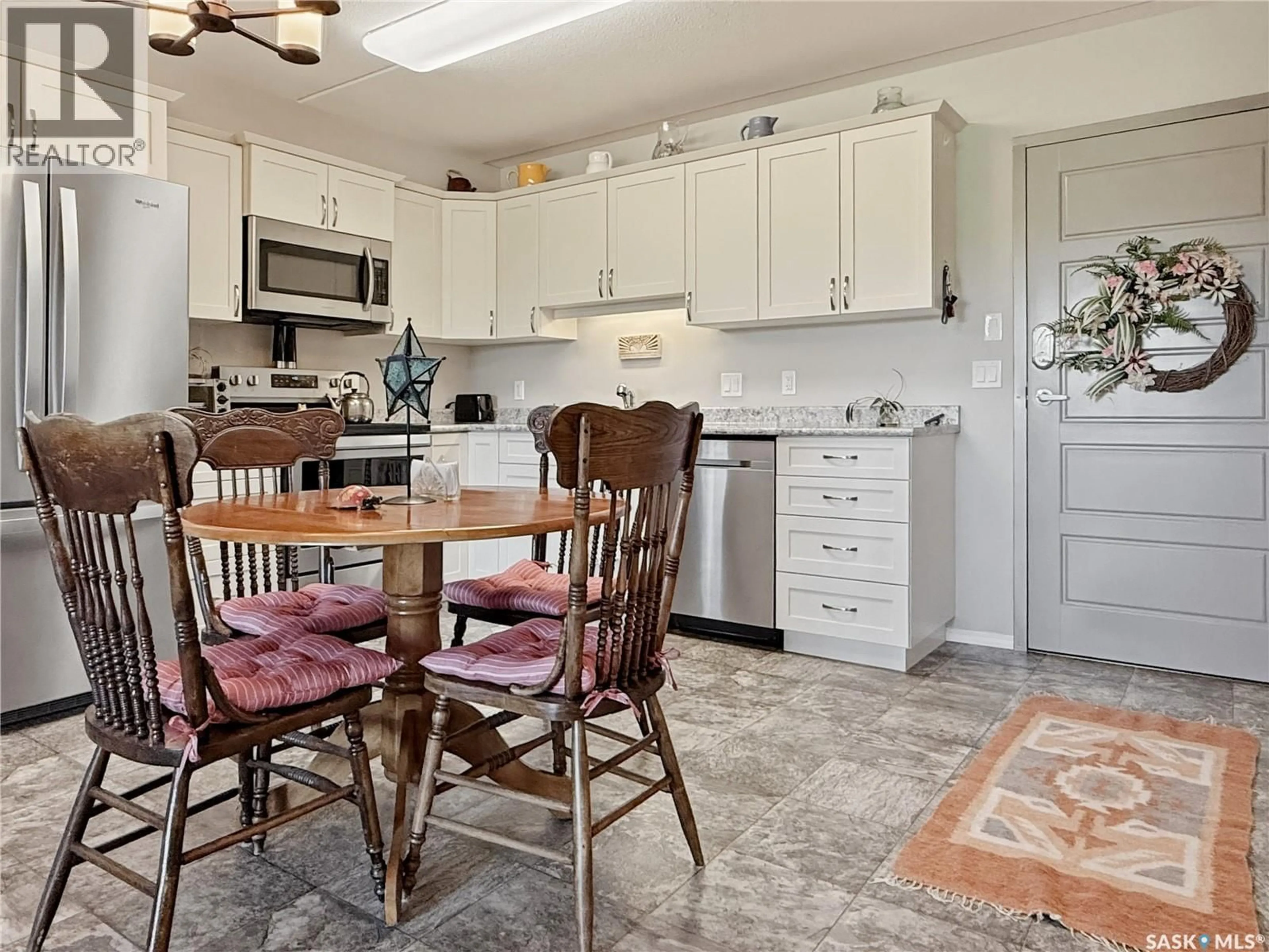 Open concept kitchen, ceramic/tile floor for 201 2426 BUHLER AVENUE, North Battleford Saskatchewan S9A1R5
