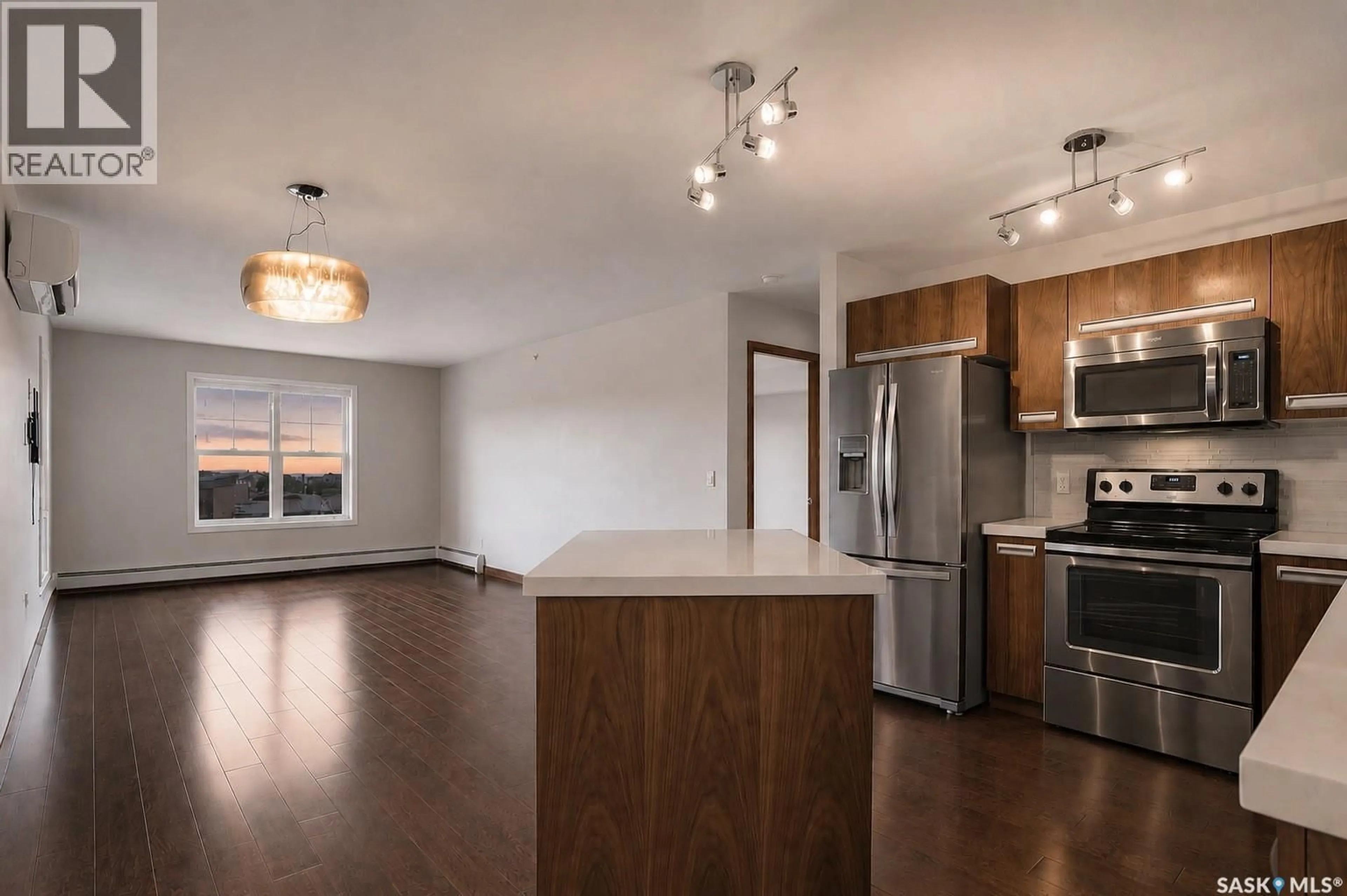 Open concept kitchen, wood/laminate floor for 130 - 305 PHELPS WAY, Saskatoon Saskatchewan S7V0K5