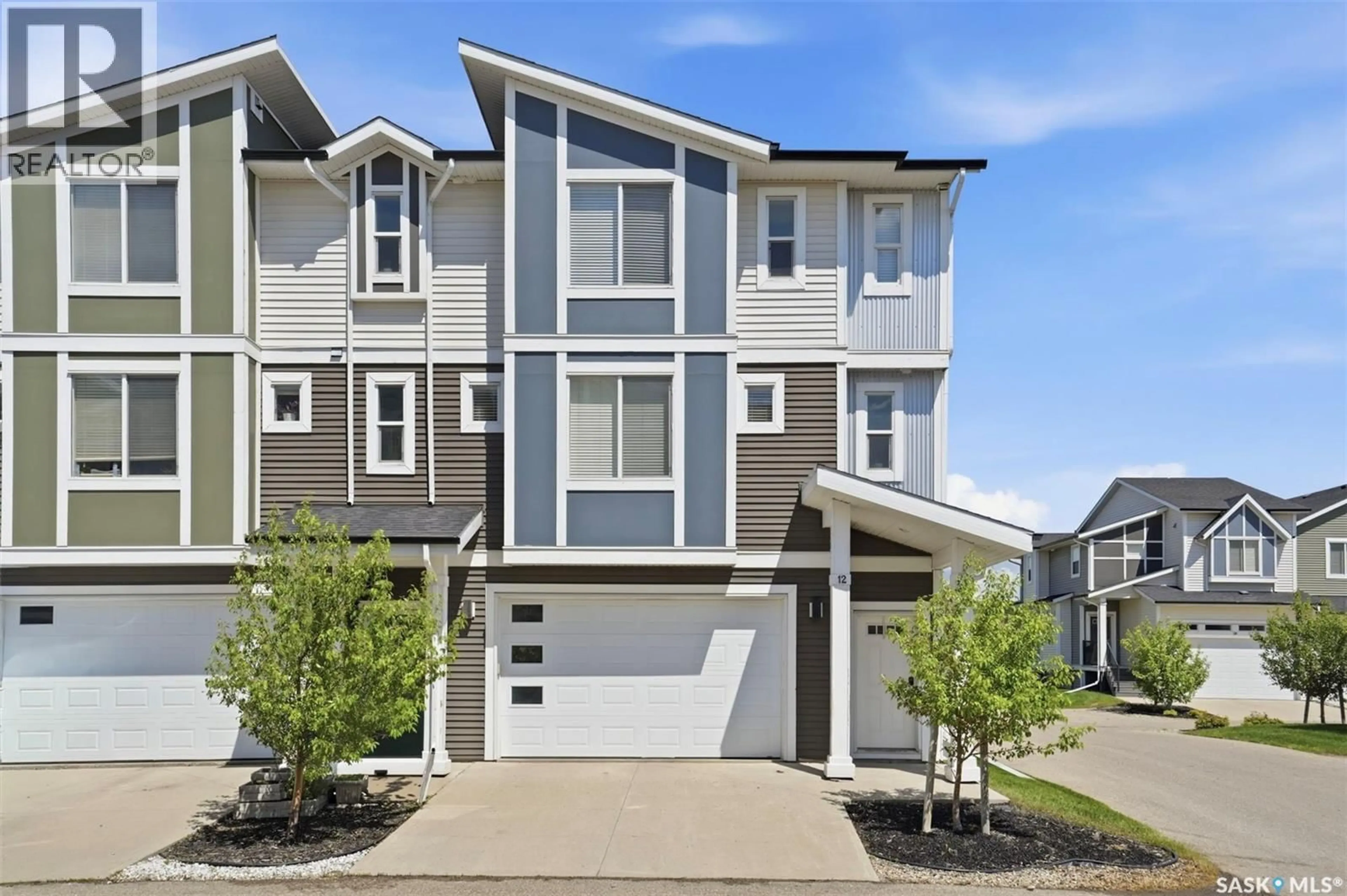 Home with vinyl exterior material, street for 12 600 MAPLE CRESCENT, Warman Saskatchewan S0K4S1