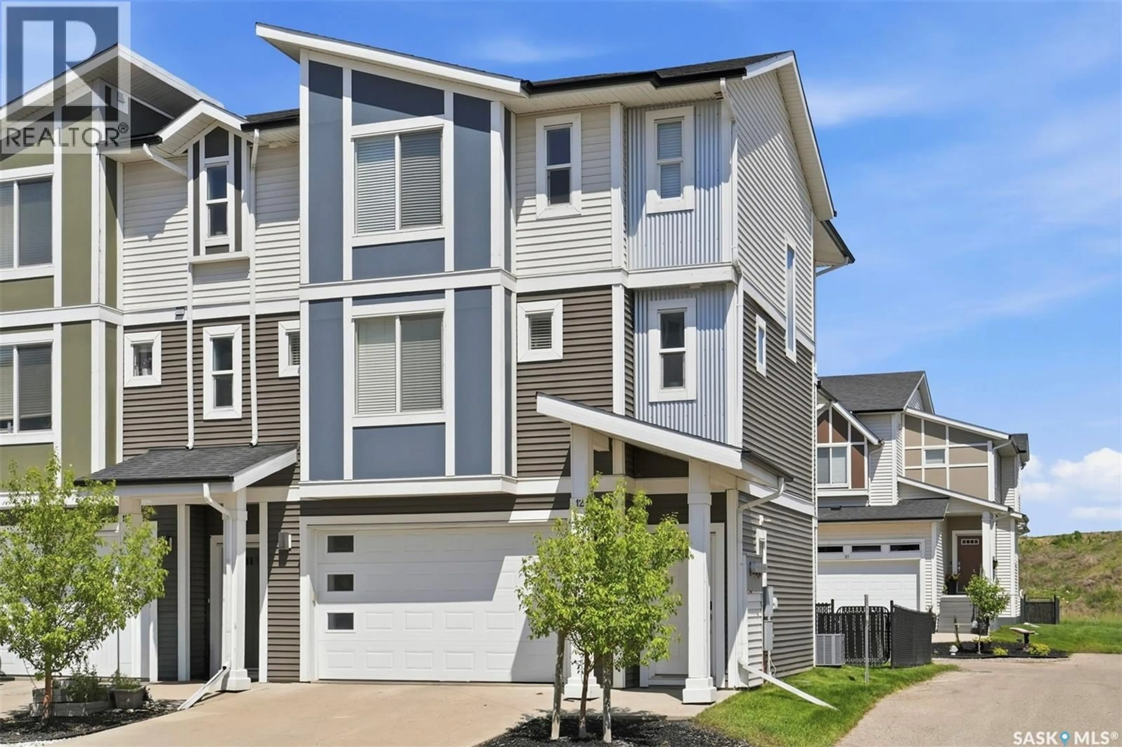 Home with vinyl exterior material, street for 12 600 MAPLE CRESCENT, Warman Saskatchewan S0K4S1
