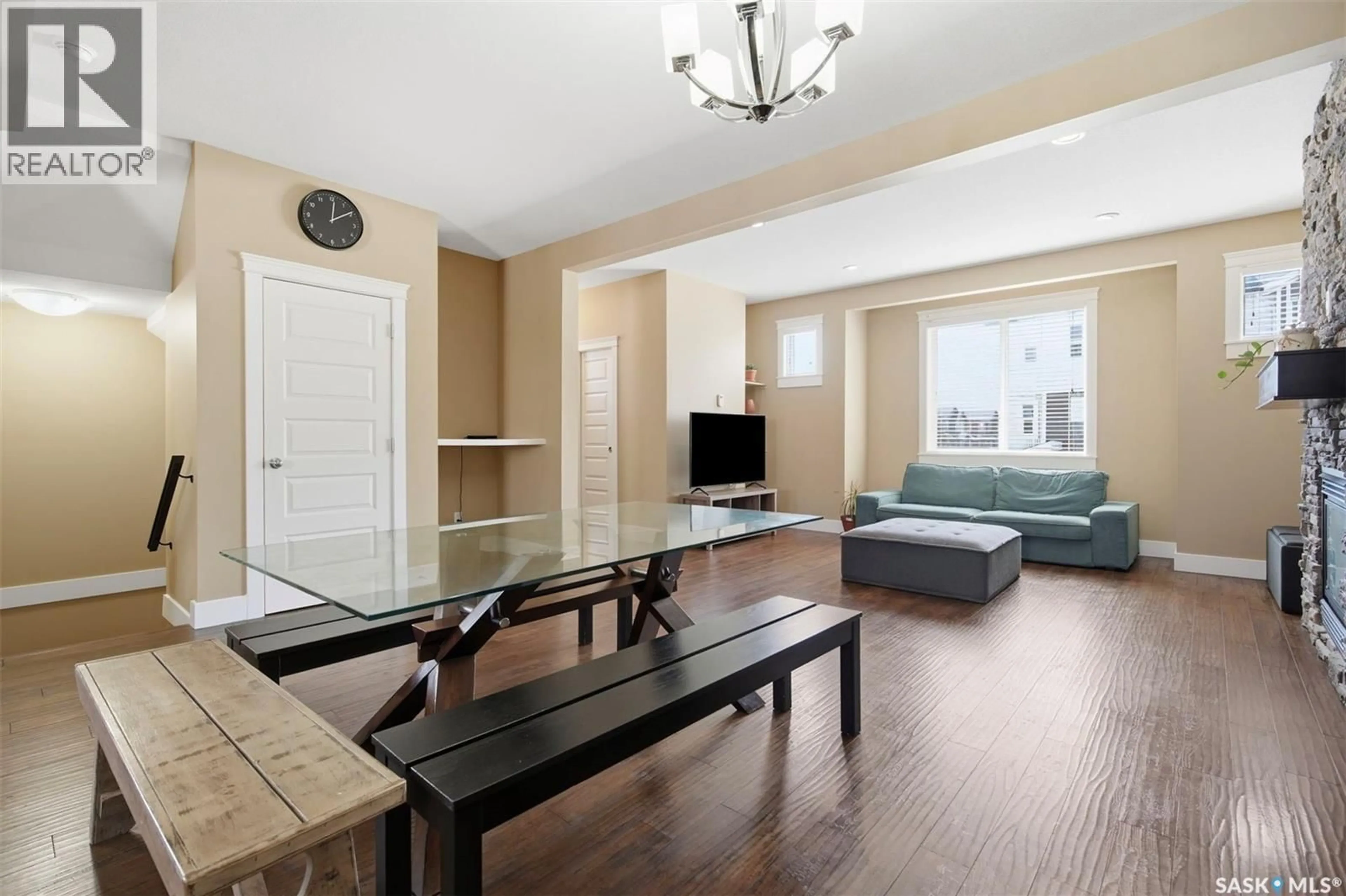 Living room with furniture, wood/laminate floor for 12 600 MAPLE CRESCENT, Warman Saskatchewan S0K4S1
