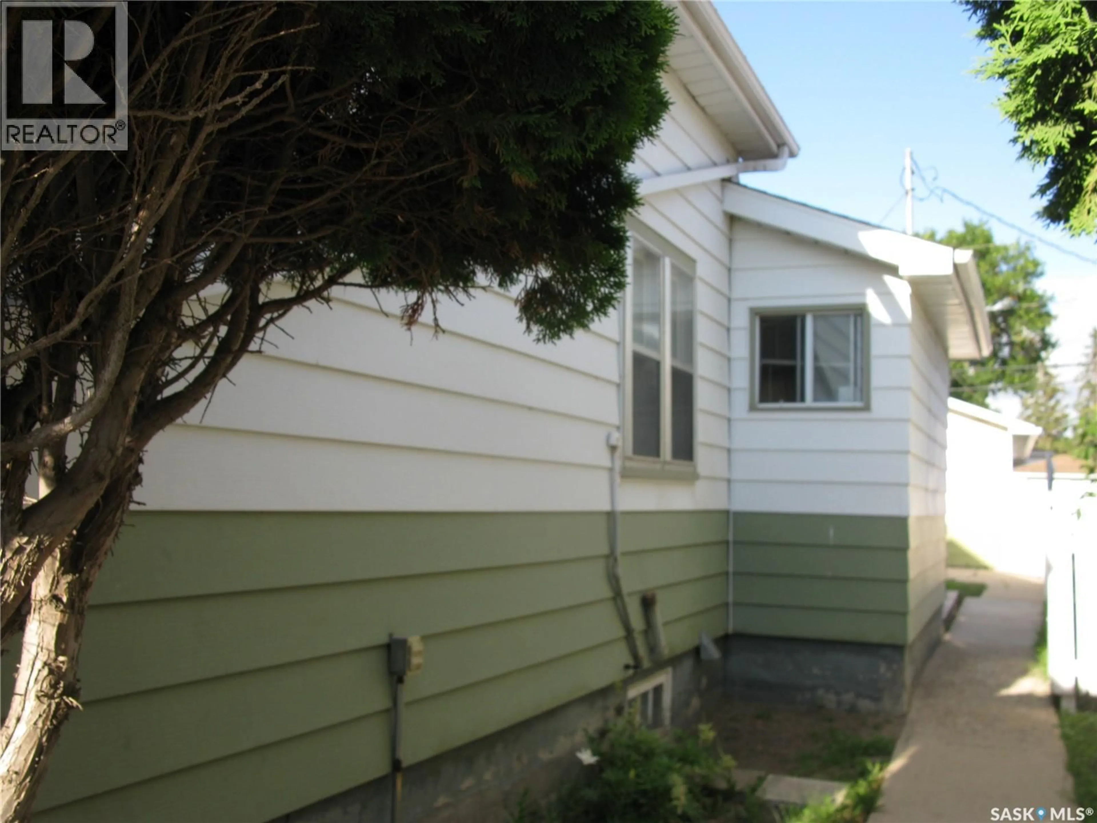Home with vinyl exterior material, street for 2037 REYNOLDS STREET, Regina Saskatchewan S4N3M9