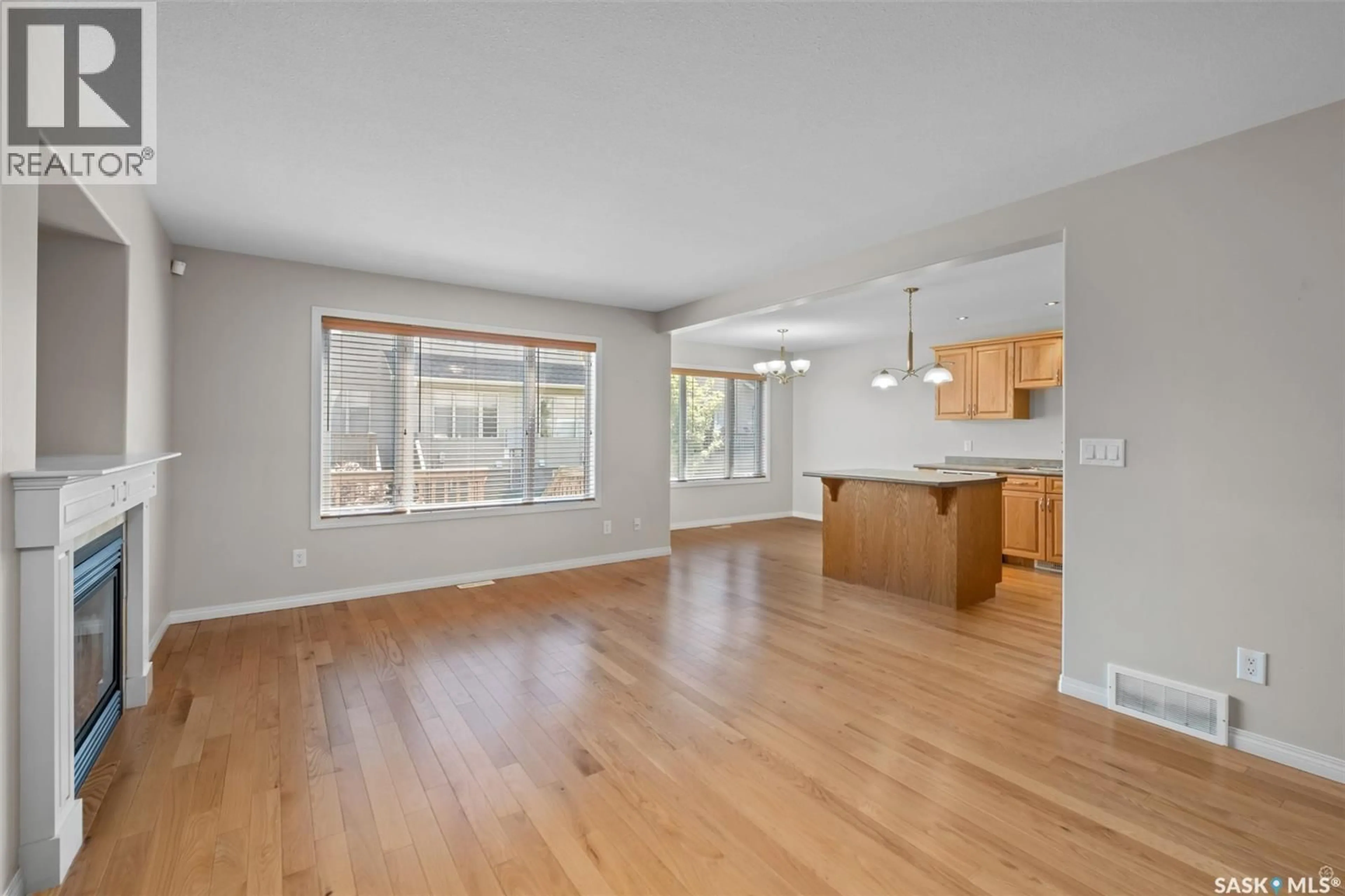 Open concept kitchen, wood/laminate floor for 51 1600 MUZZY DRIVE, Prince Albert Saskatchewan S6X0A2