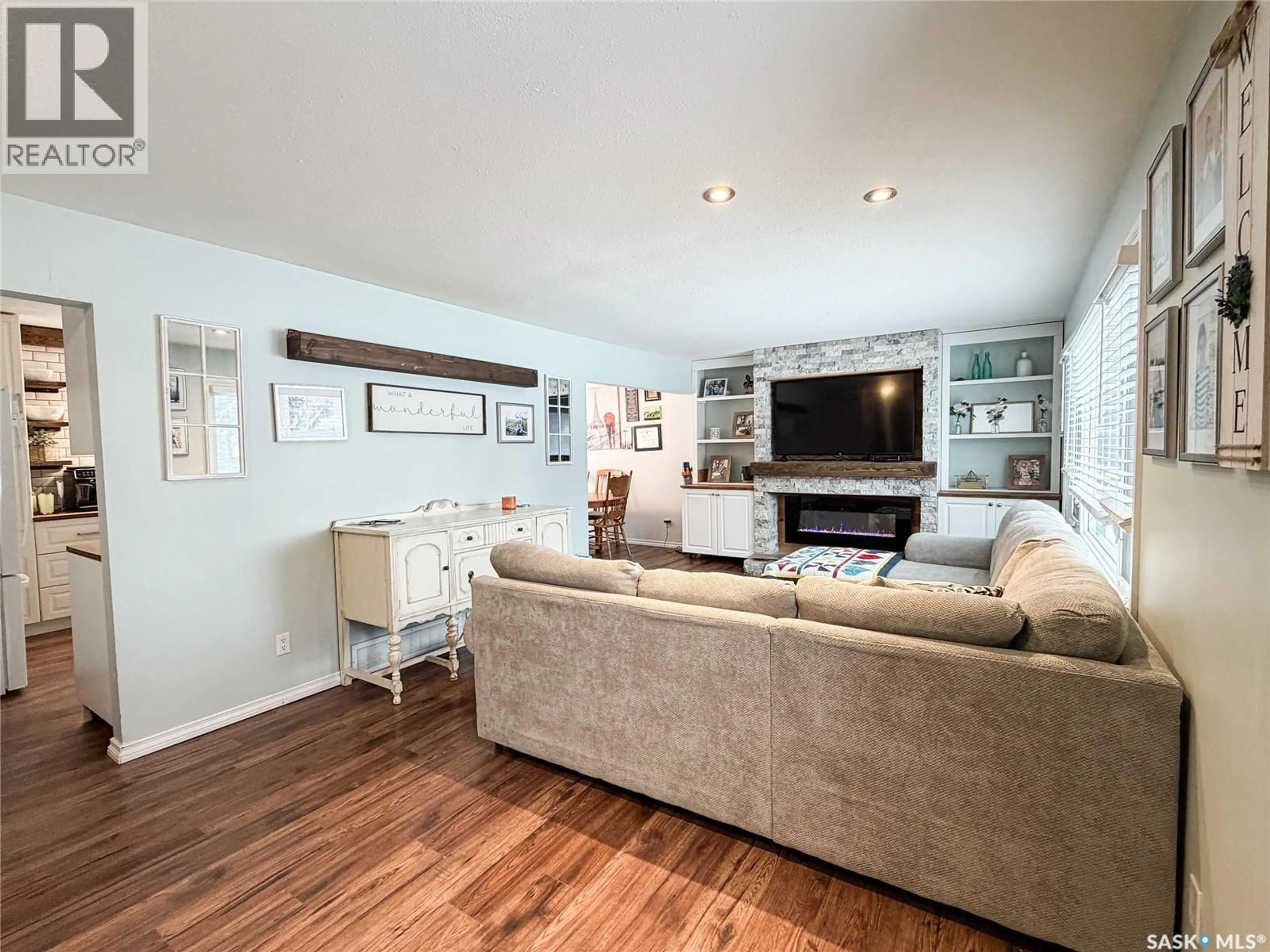 Living room with furniture, wood/laminate floor for 420 1ST STREET W, Meadow Lake Saskatchewan S9X1E5