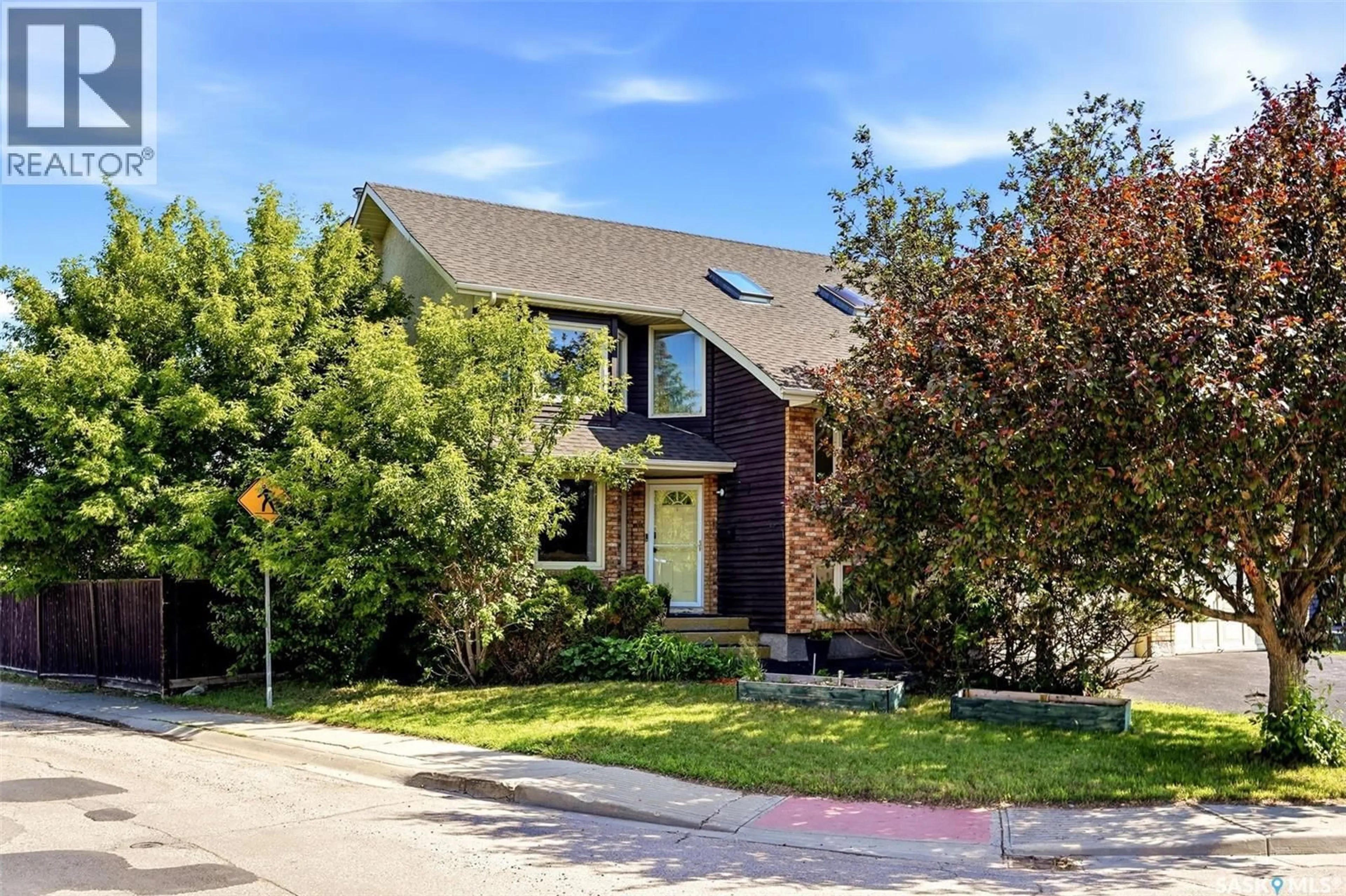 Home with brick exterior material, street for 6703 MAPLECREST PLACE, Regina Saskatchewan S4X3Z1
