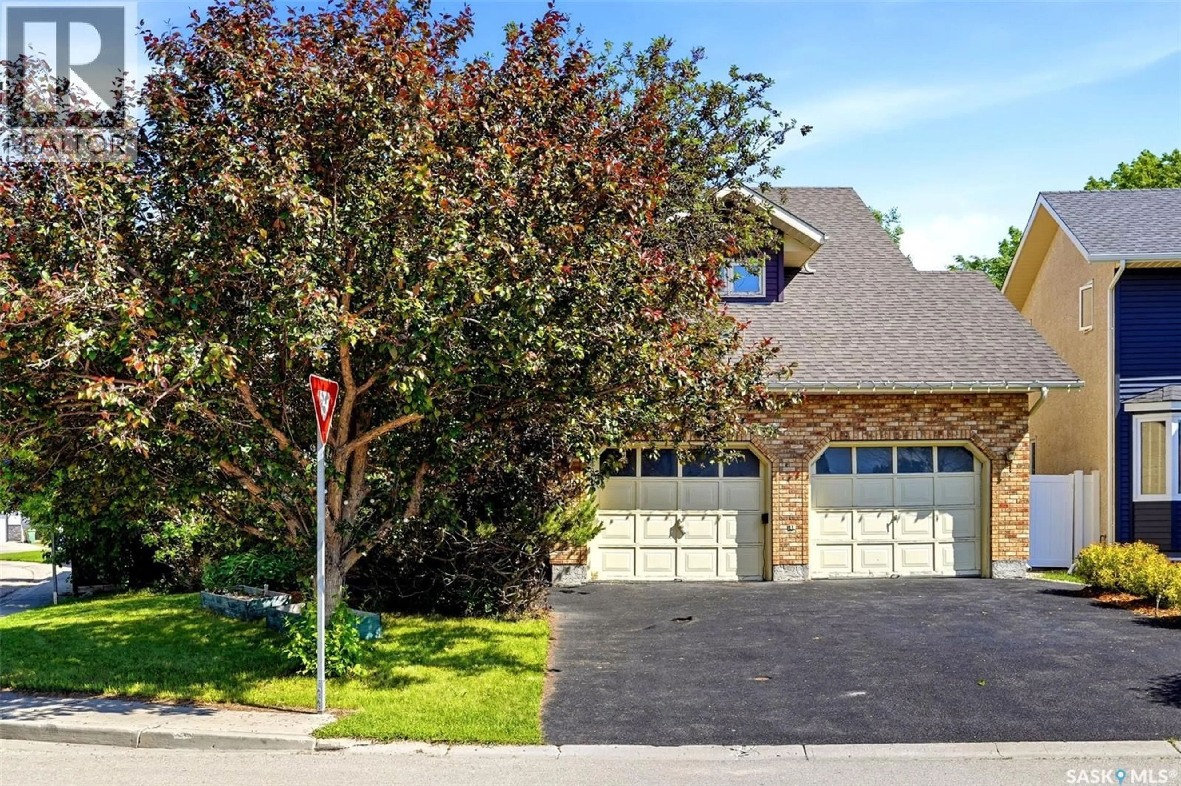 Home with brick exterior material, street for 6703 MAPLECREST PLACE, Regina Saskatchewan S4X3Z1