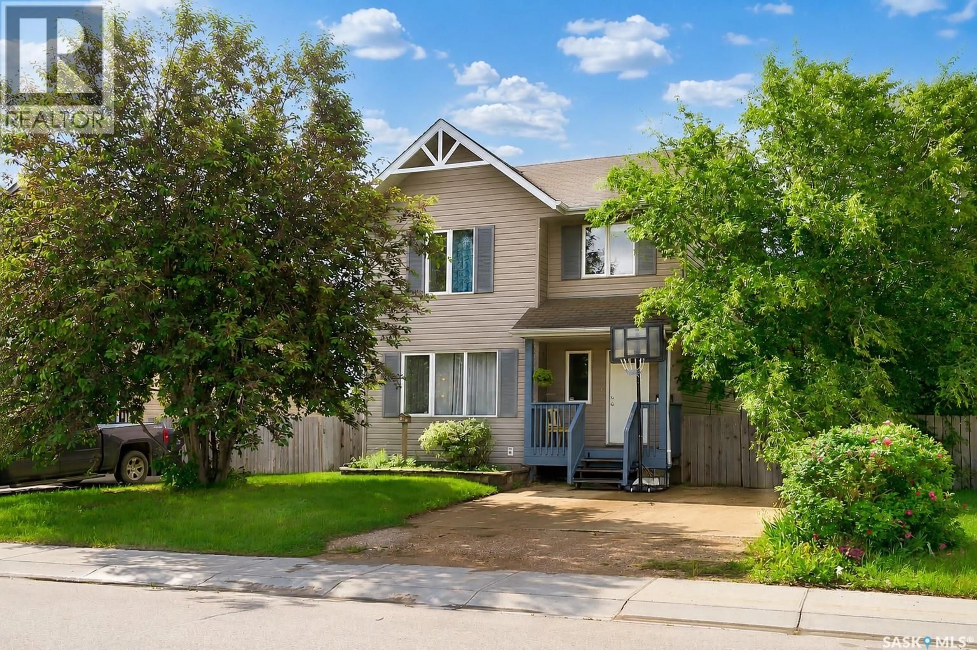Home with vinyl exterior material, street for 103 HAICHERT STREET, Warman Saskatchewan S0K4S0