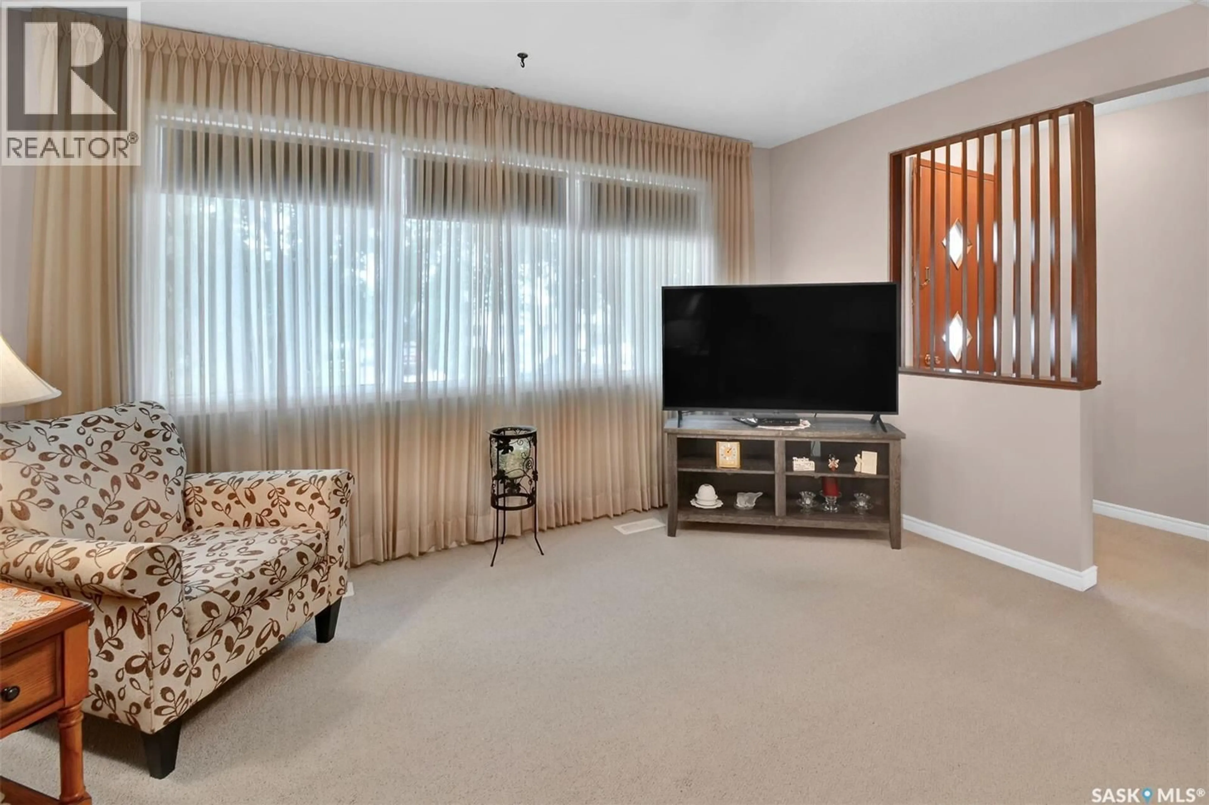 Living room with furniture, carpet floor for 1721 EMPIRE AVENUE, Saskatoon Saskatchewan S7K3E9