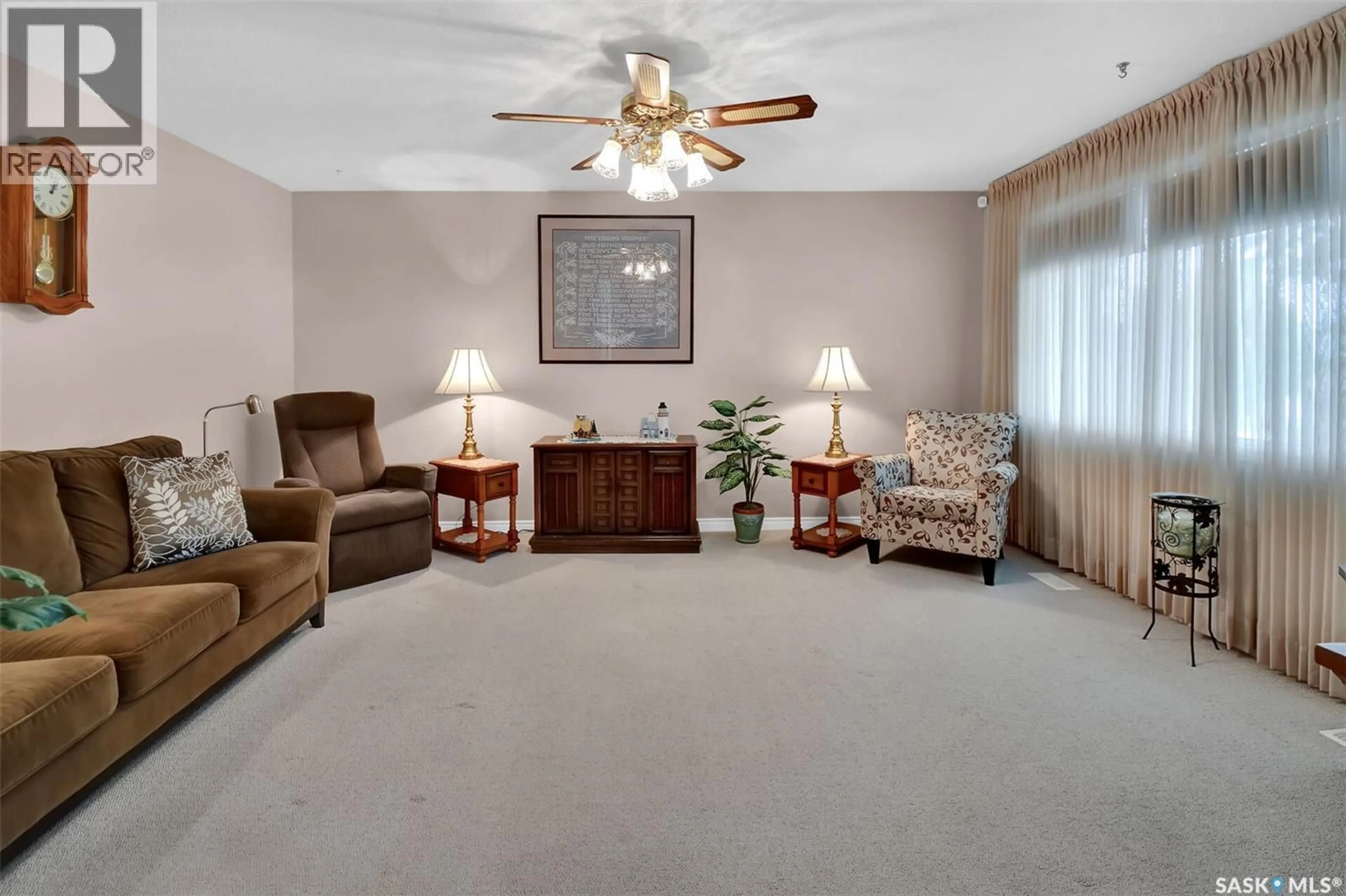 Living room with furniture, carpet floor for 1721 EMPIRE AVENUE, Saskatoon Saskatchewan S7K3E9