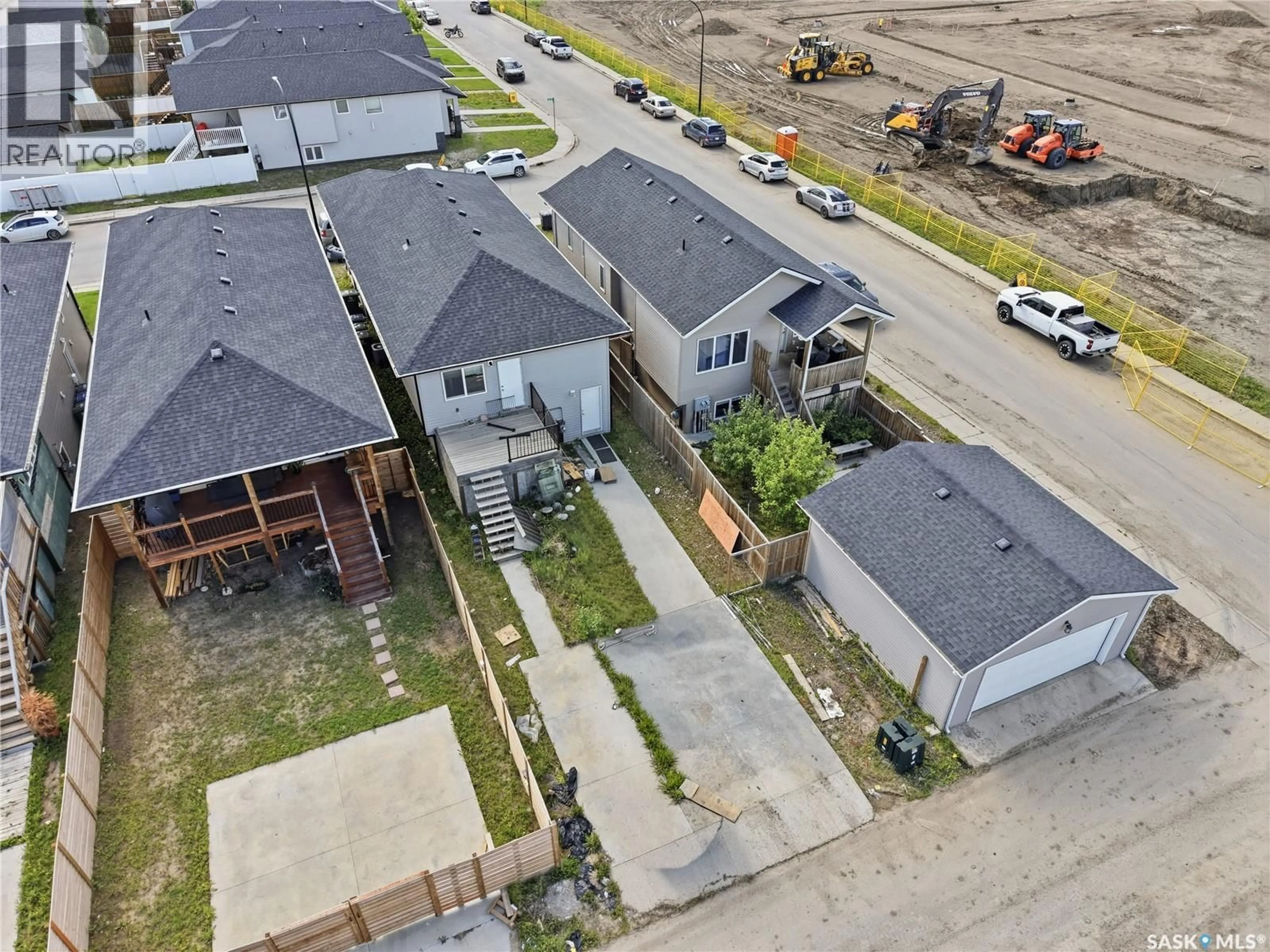 A pic from outside/outdoor area/front of a property/back of a property/a pic from drone, street for 706 ELLS LANE, Saskatoon Saskatchewan S7L6H9
