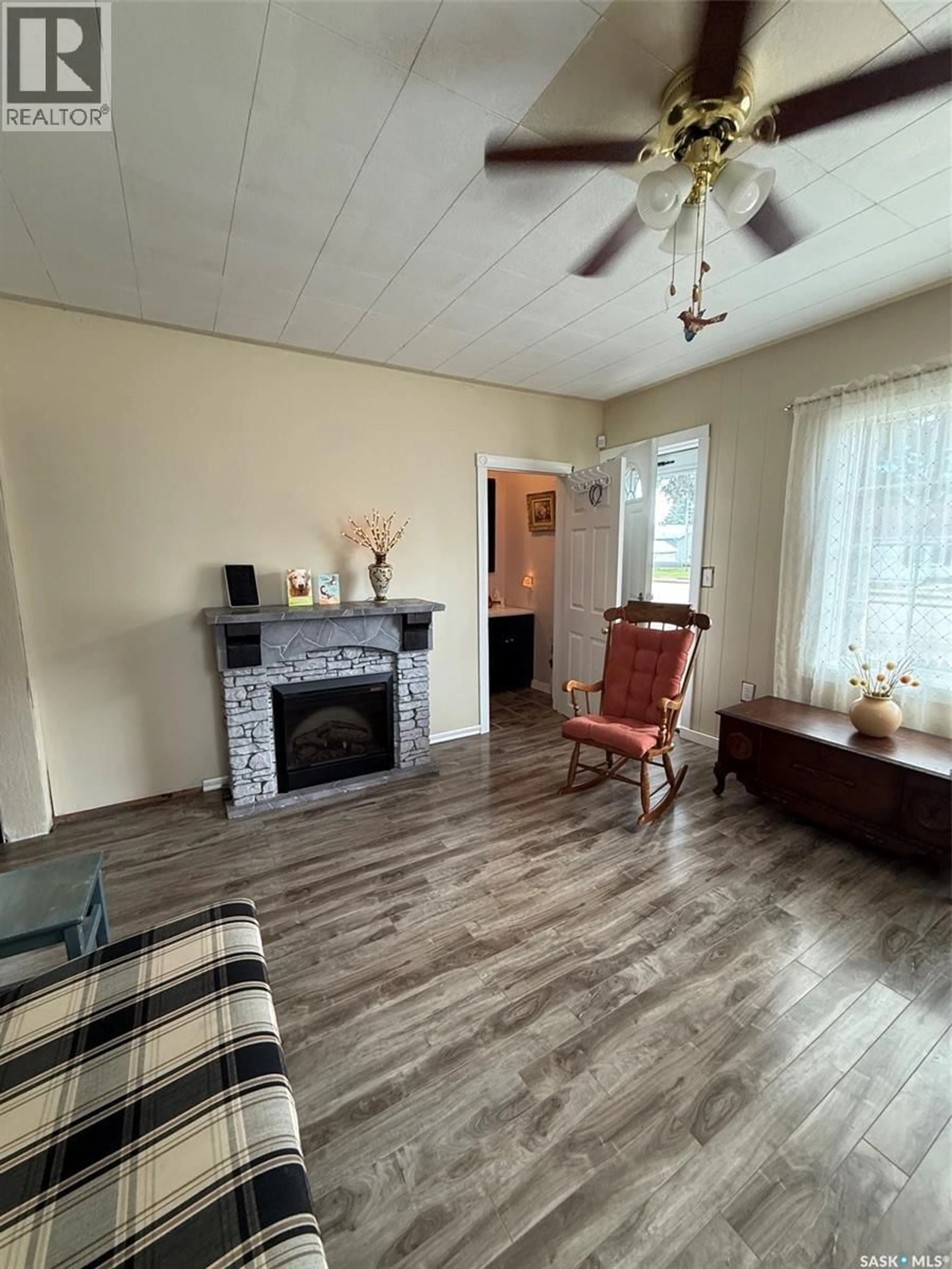 Living room with furniture, wood/laminate floor for 3012 MAIN STREET, Edam Saskatchewan S0M0V0