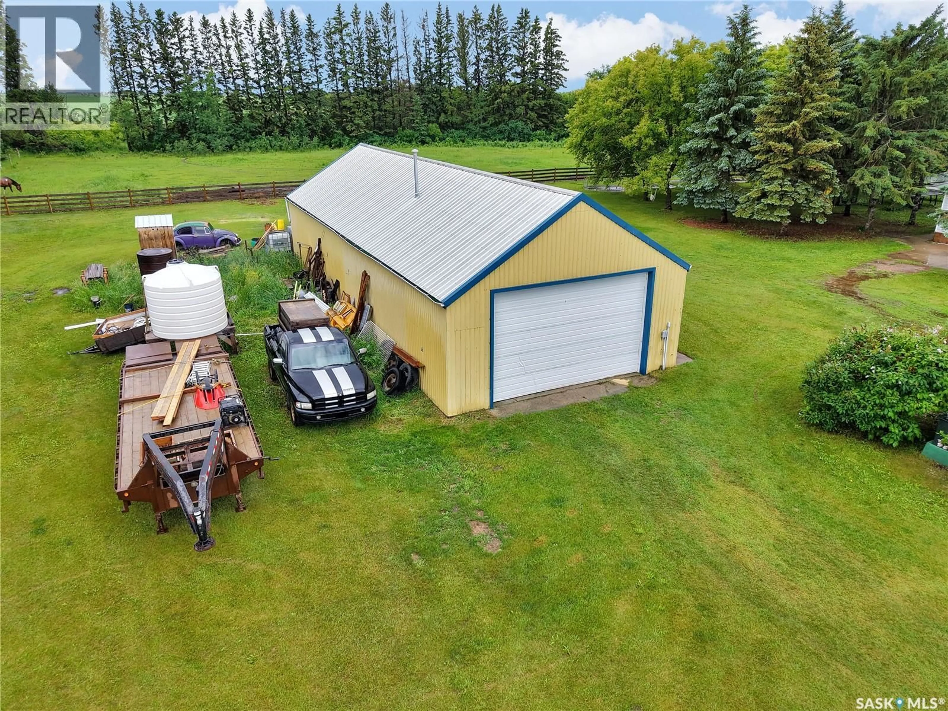 A pic from outside/outdoor area/front of a property/back of a property/a pic from drone, building for BUECKERT ACREAGE, Rosthern Rm No. 403 Saskatchewan S0K4R0