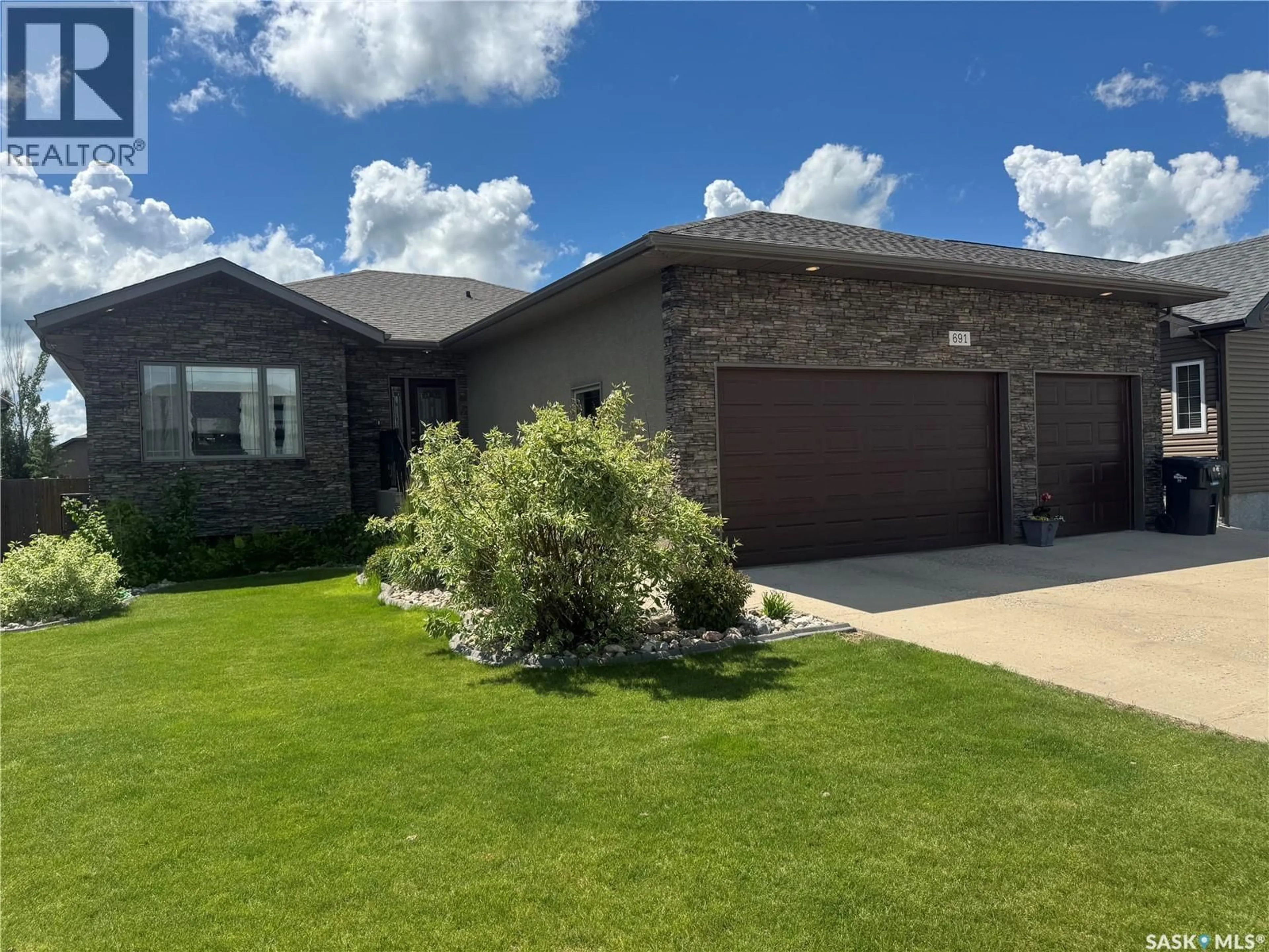 Home with brick exterior material, street for 691 BARBER CRESCENT, Weyburn Saskatchewan S4H0B9
