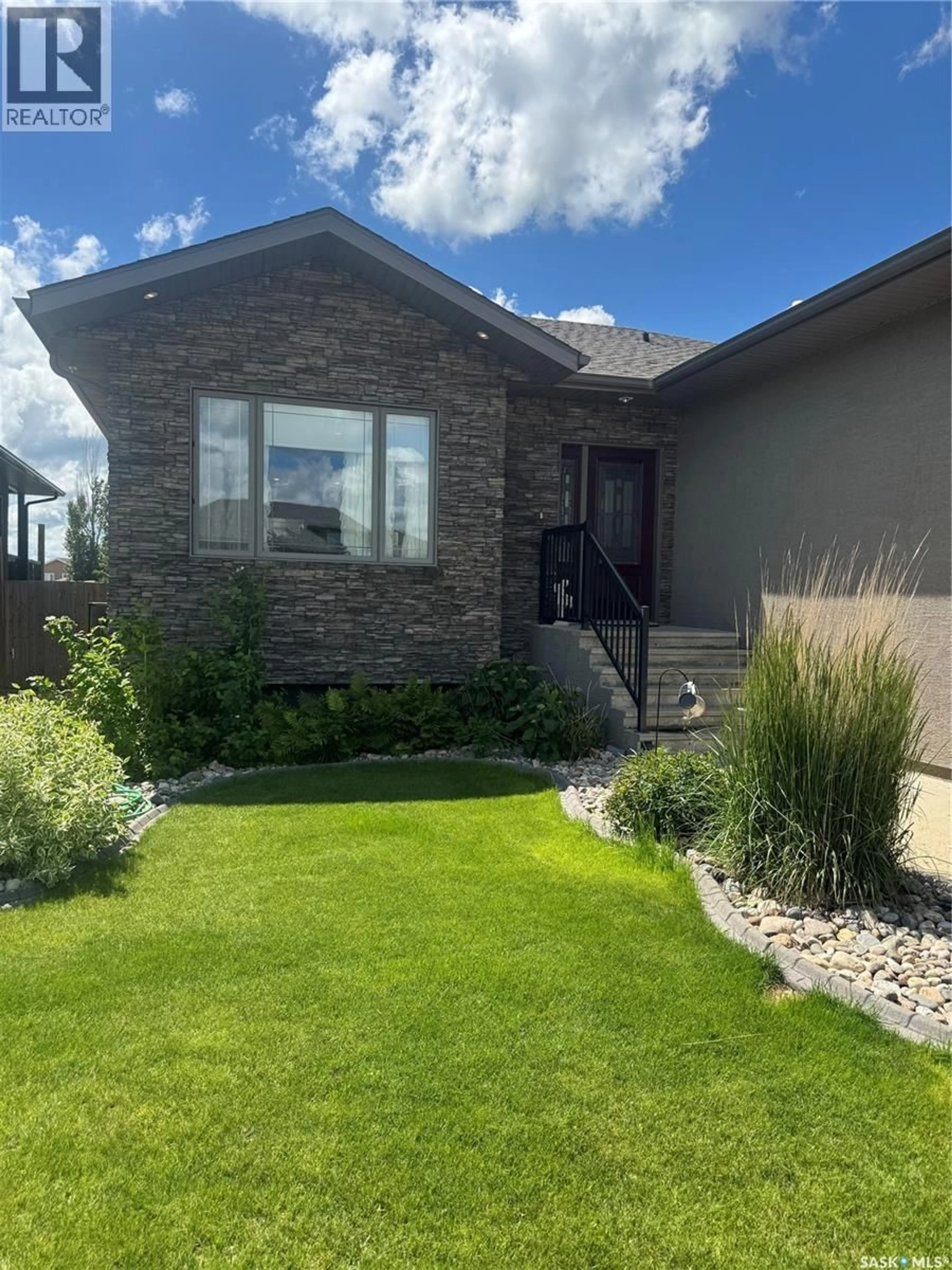 Home with brick exterior material, street for 691 BARBER CRESCENT, Weyburn Saskatchewan S4H0B9
