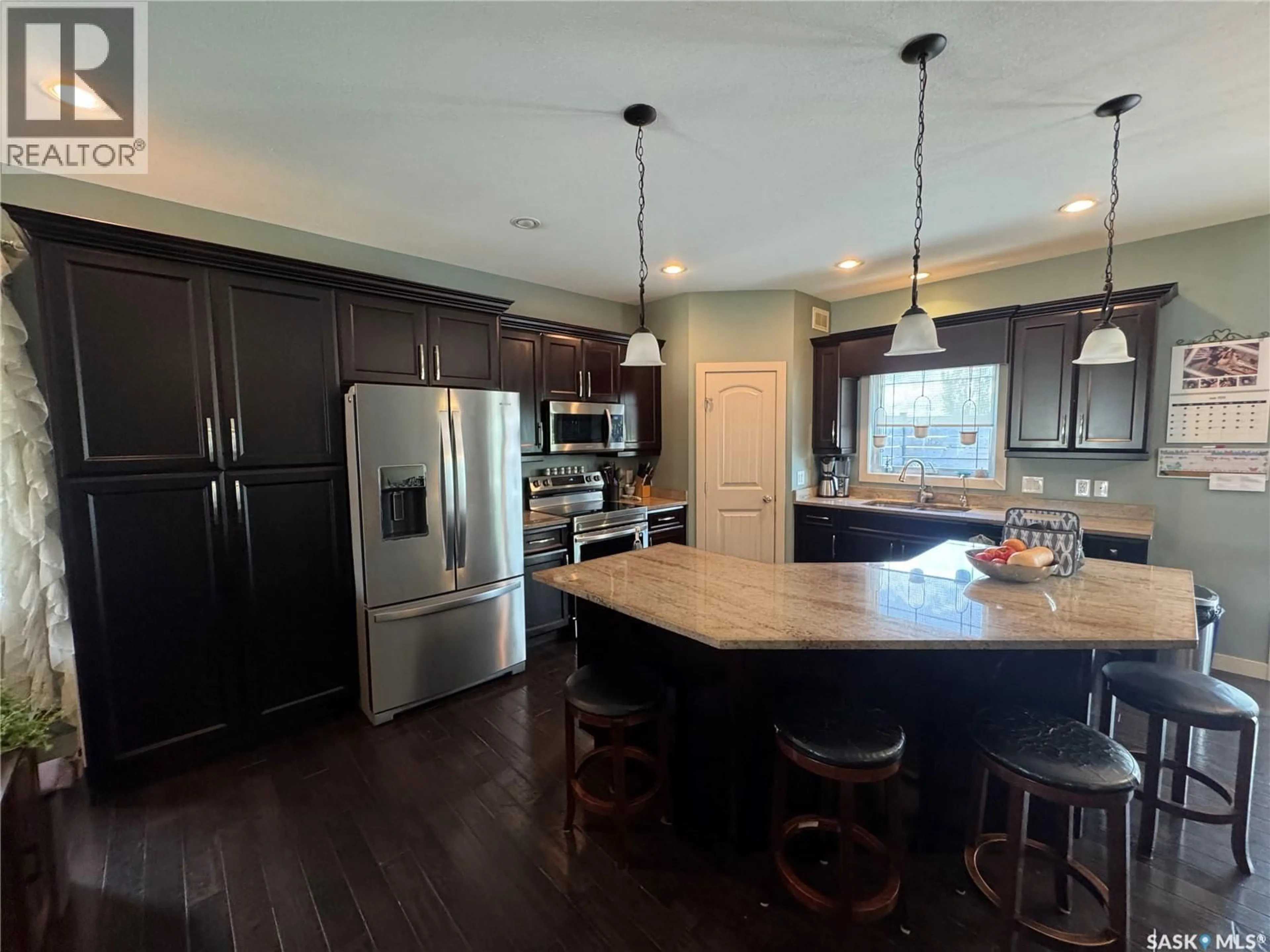 Open concept kitchen, unknown for 691 BARBER CRESCENT, Weyburn Saskatchewan S4H0B9