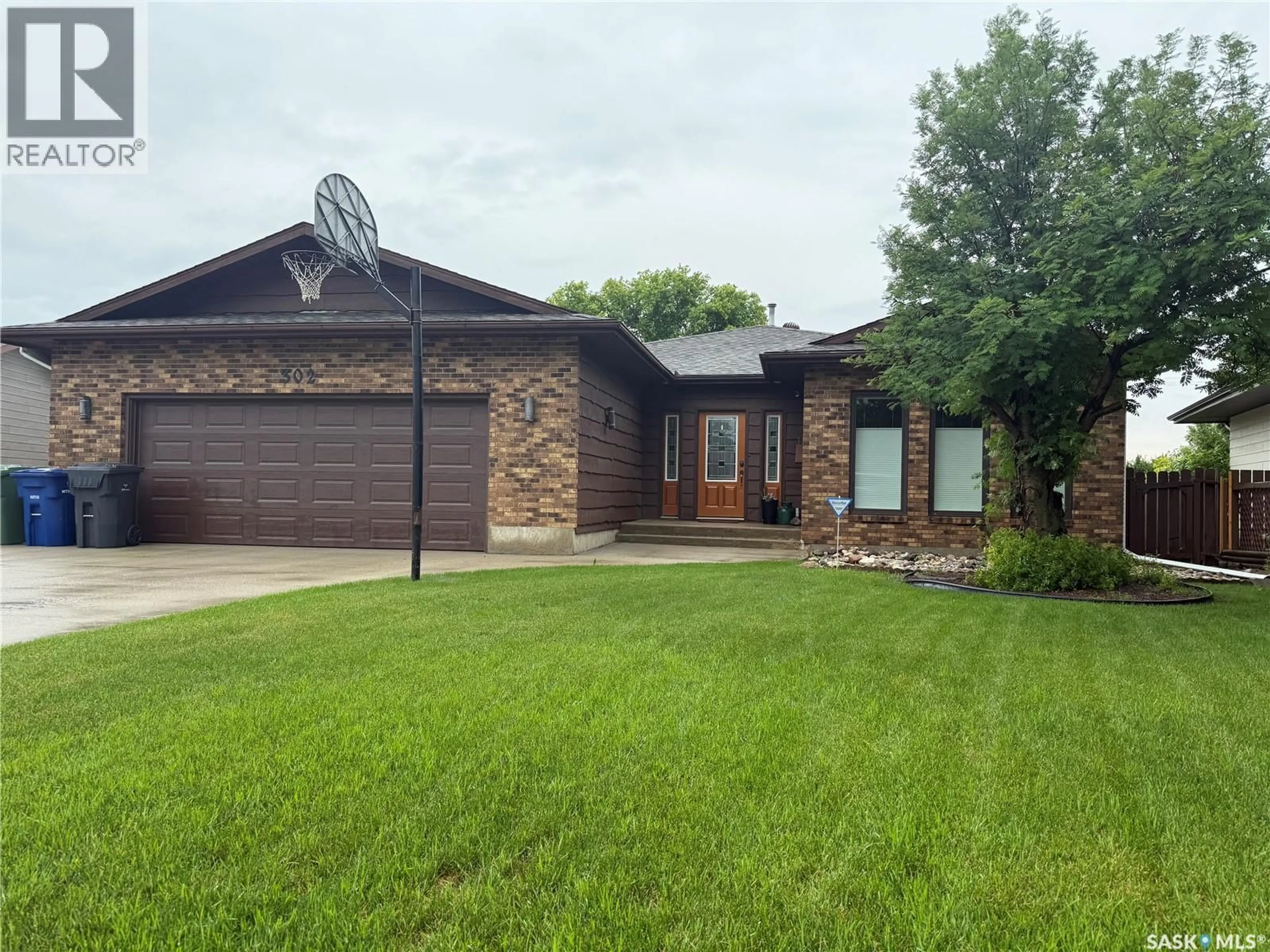 Home with brick exterior material, street for 302 WATSON CRESCENT, Nipawin Saskatchewan S0E1E0