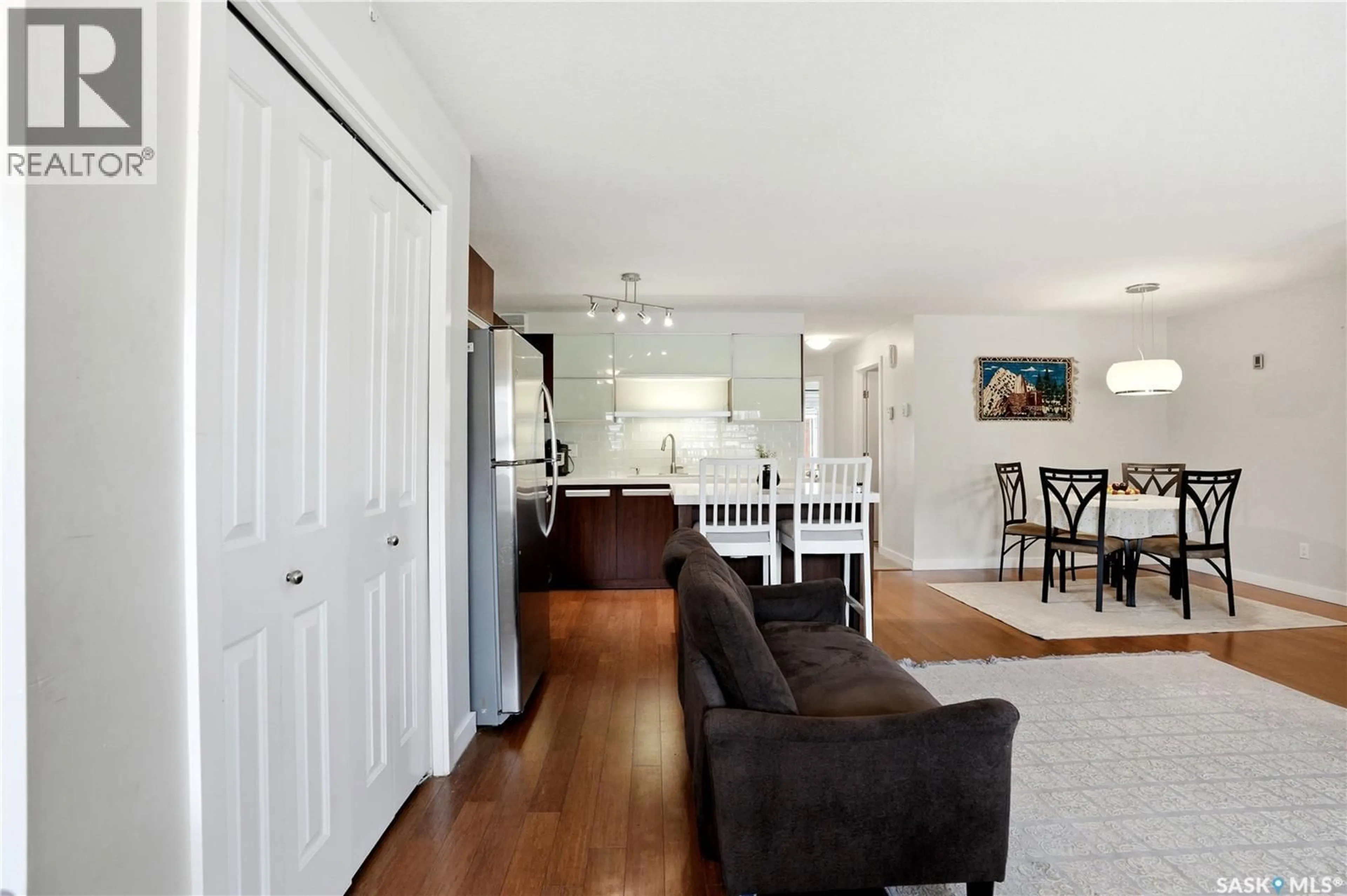 Living room with furniture, wood/laminate floor for 1015 - 407 PATRICK CRESCENT, Saskatoon Saskatchewan S7W0M3