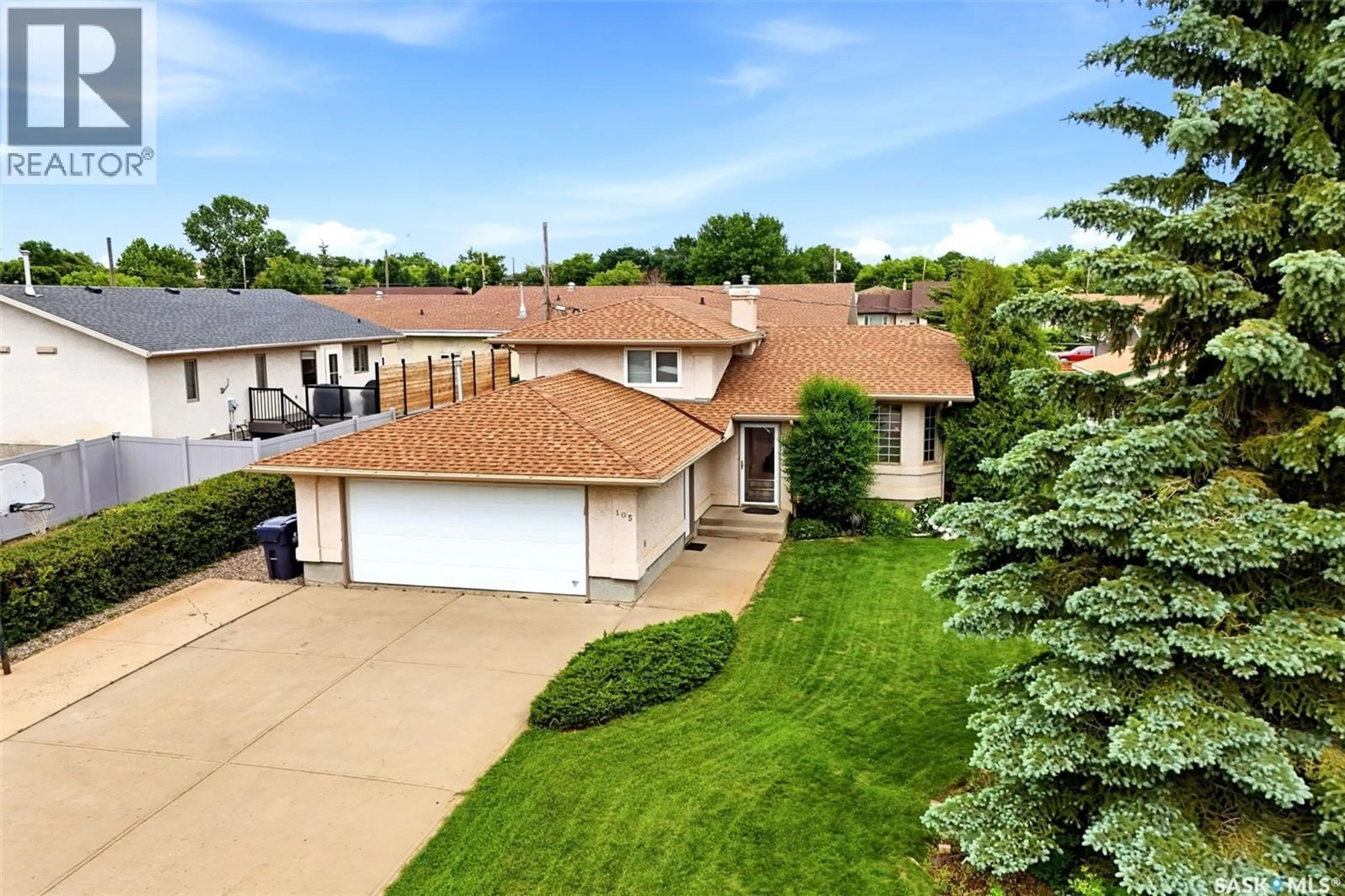 A pic from outside/outdoor area/front of a property/back of a property/a pic from drone, street for 105 COURTSIDE CRESCENT, Pilot Butte Saskatchewan S0G3Z0