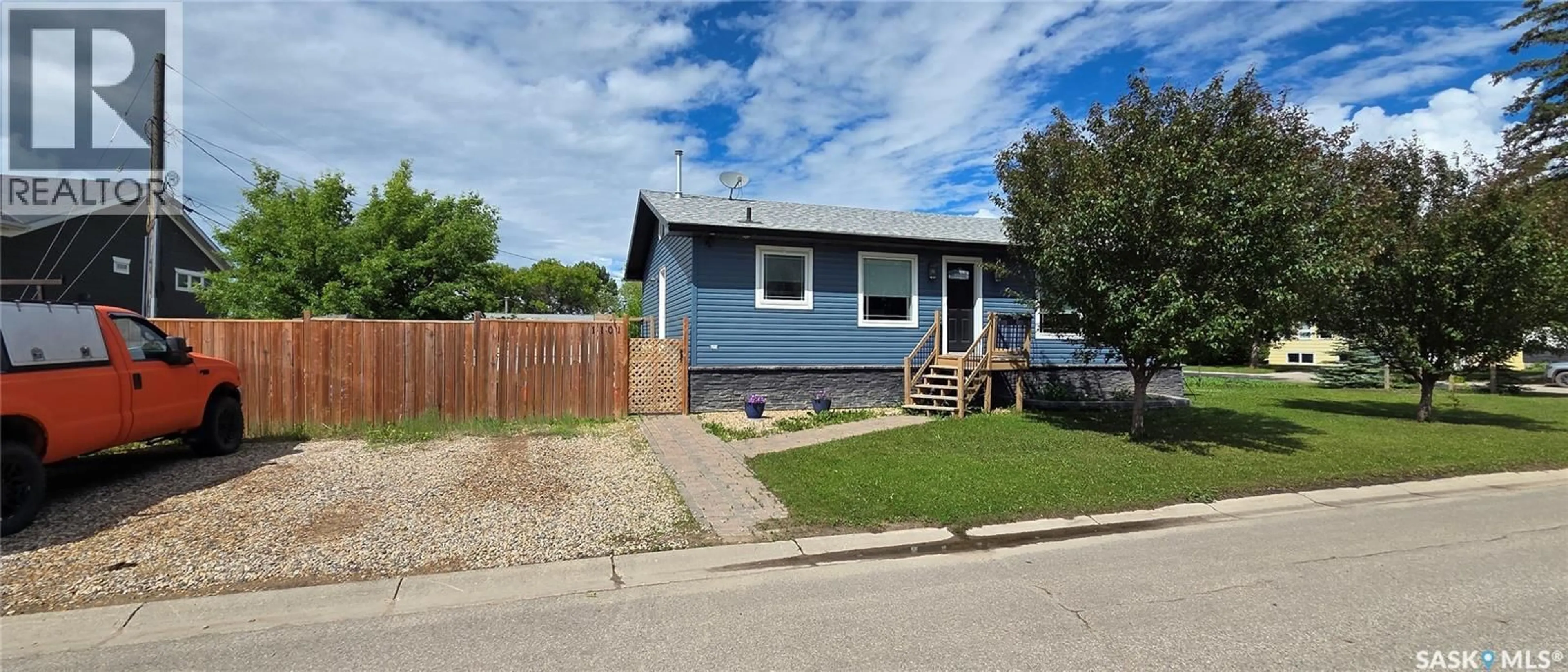 Home with vinyl exterior material, street for 1101 94TH STREET, Tisdale Saskatchewan S0E1T0