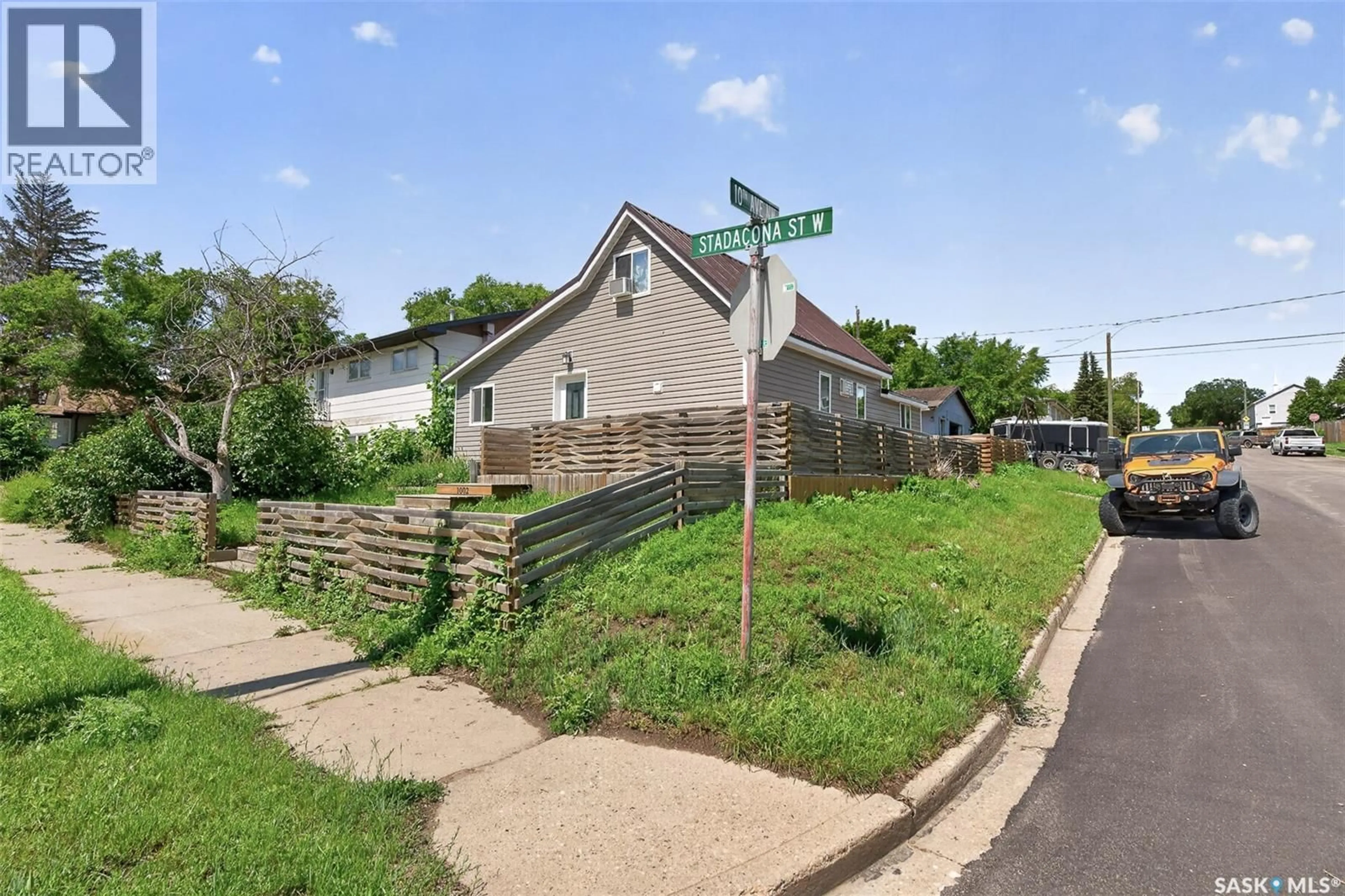 A pic from outside/outdoor area/front of a property/back of a property/a pic from drone, street for 1002 STADACONA STREET, Moose Jaw Saskatchewan S6H0K9