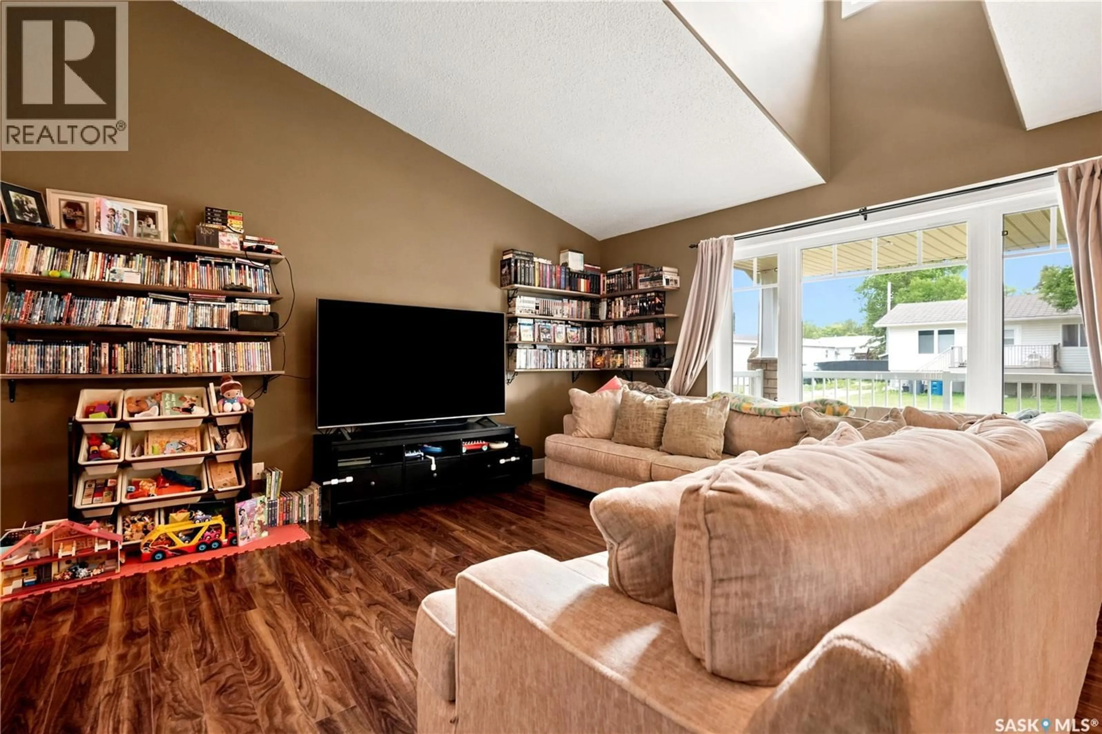 Living room with furniture, wood/laminate floor for 9 JARVIS STREET, Qu'Appelle Saskatchewan S0G4A0