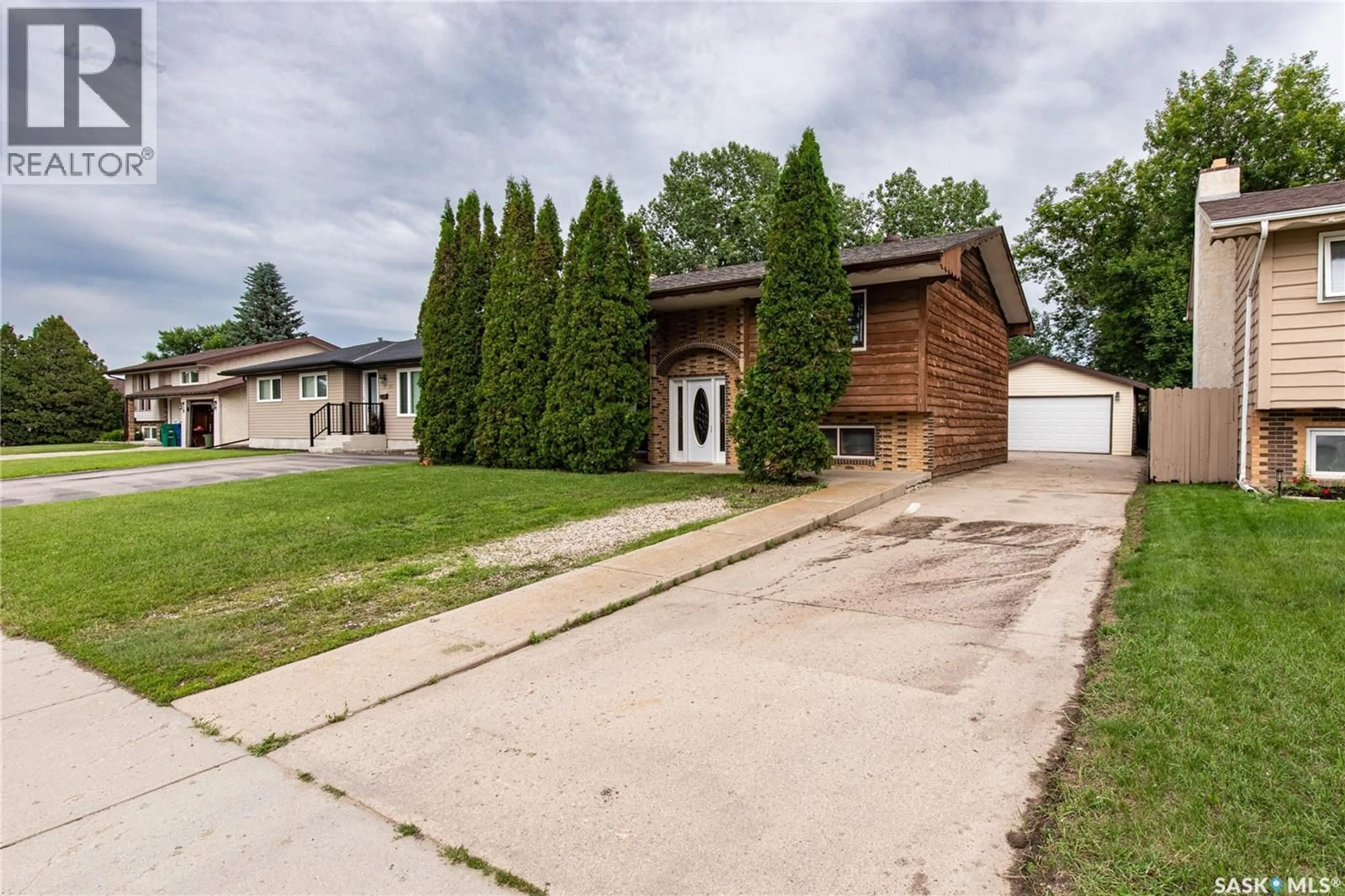 Home with brick exterior material, street for 17 BLUE SAGE DRIVE, Moose Jaw Saskatchewan S6J1A5