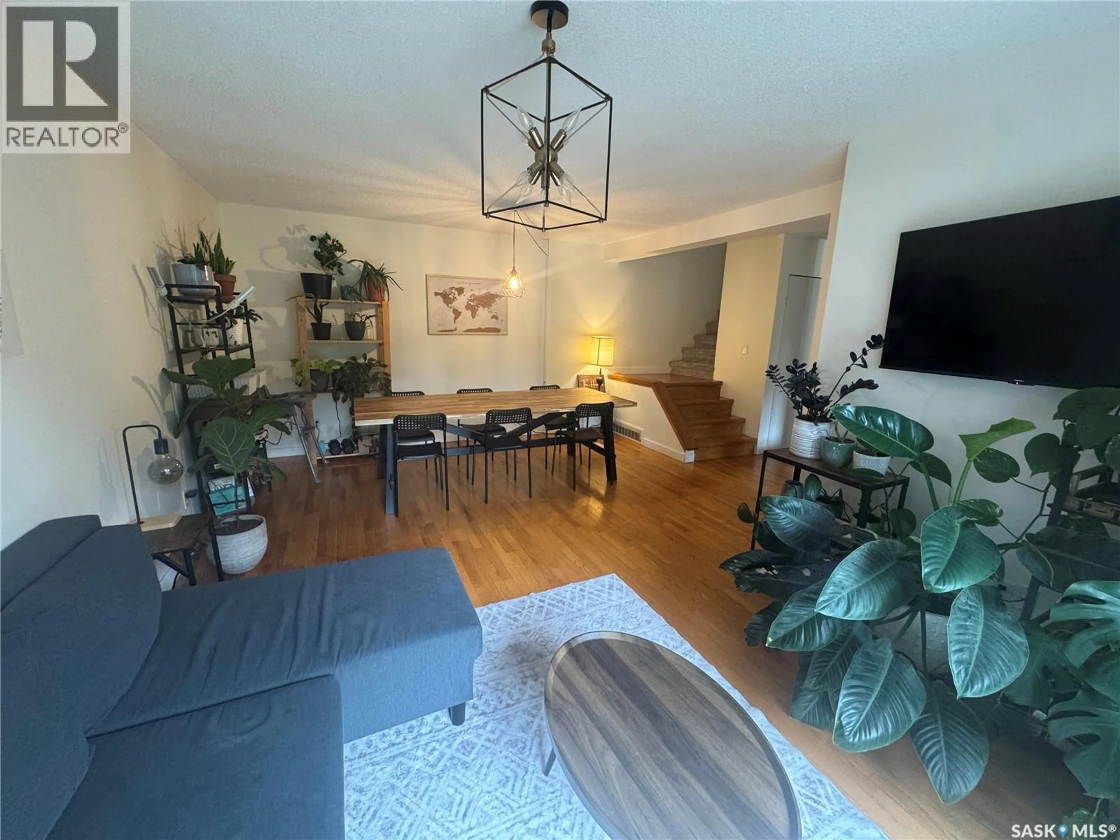 Living room with furniture, wood/laminate floor for 35 215 PRIMROSE DRIVE, Saskatoon Saskatchewan S7K5H9