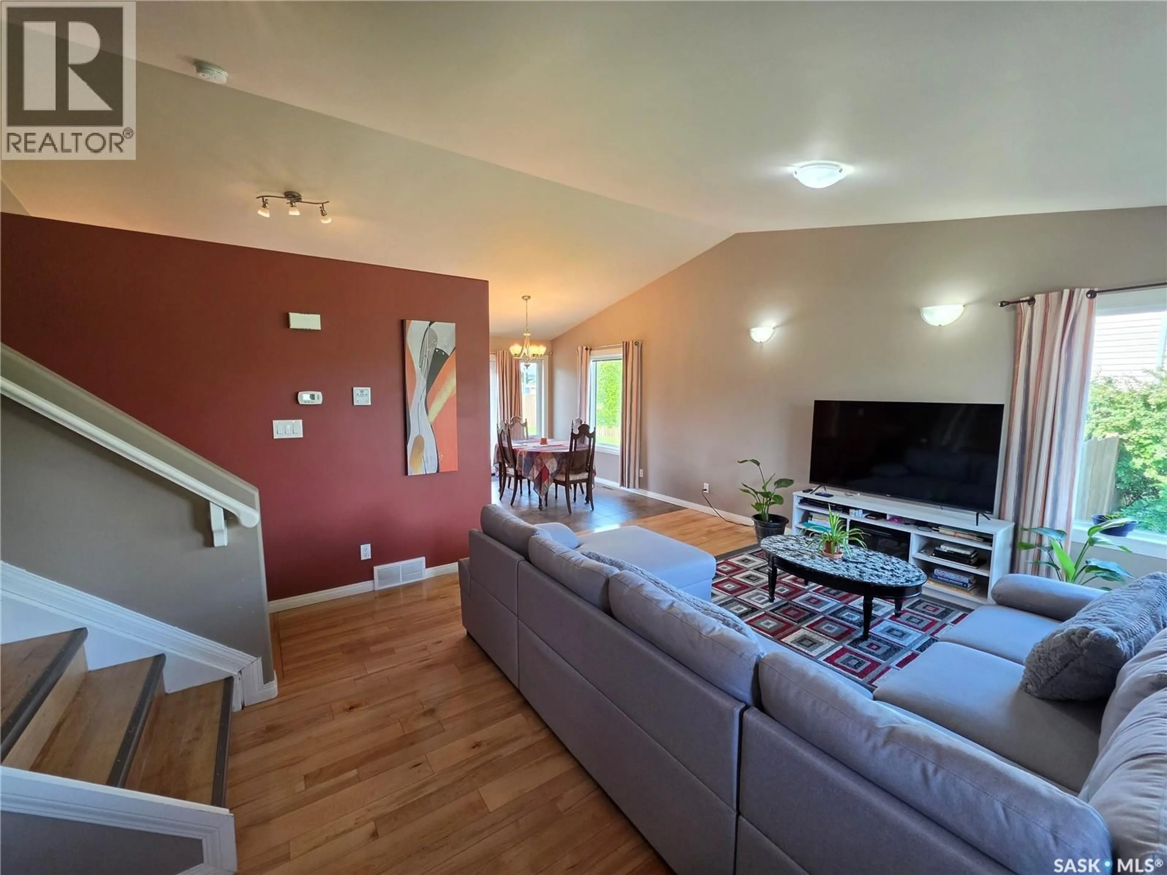 Living room with furniture, wood/laminate floor for 612 7TH AVENUE, Meadow Lake Saskatchewan S9X1B1
