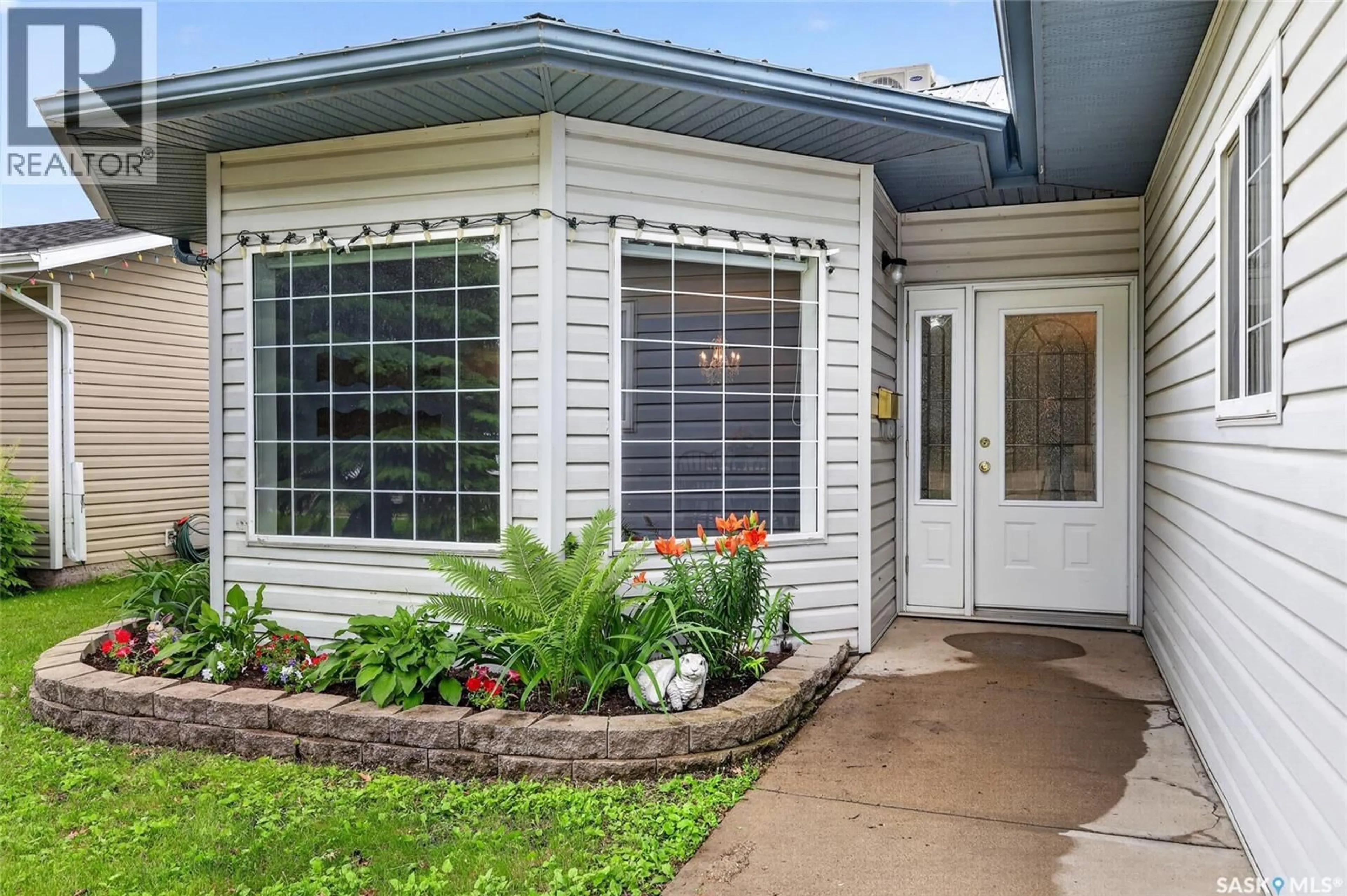 Home with vinyl exterior material, street for 206 2ND, Hague Saskatchewan S0K1X0